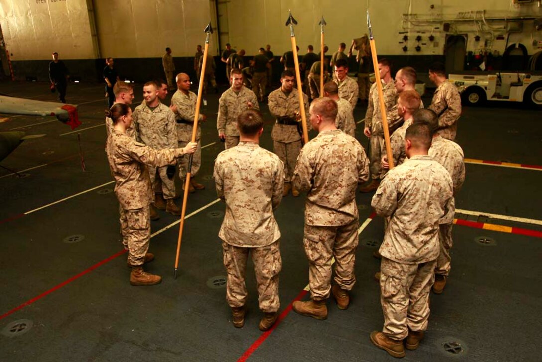 Corporals with the 15th Marine Expeditionary Unit wrap-up a day of training after Corporal's Course, Dec. 3. Corporals' Course is a professional military education for enlisted Marines designed to give them the tools to become better effective small unit leaders. The 15th MEU is deployed as part of the Peleliu Amphibious Ready Group as a U.S. Central Command theater reserve force, providing support for maritime security operations and theater security cooperation efforts in the U.S. 5th Fleet area of responsibility. (U.S. Marine Corps photo by Cpl. John Robbart III)
