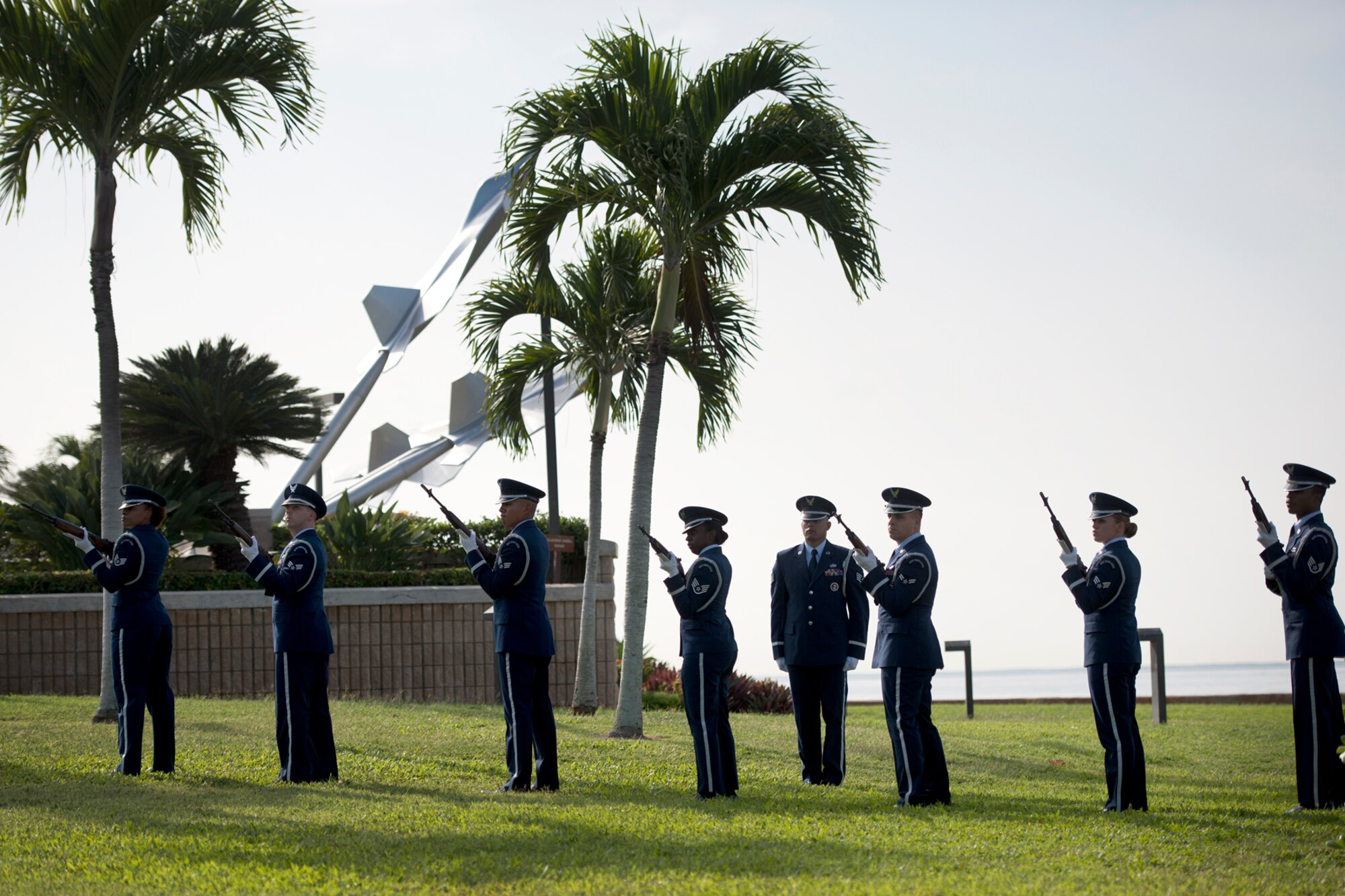 The Hickam Honor Guard fires a three round volley during the ash scattering ceremony of Senior Master Sgt. (Ret.) Raymond L. Perry, Dec. 7, 2012 at Hickam Field, Joint Base Pearl Harbor-Hickam, Hawaii. Perry was a Dec. 7, 1941, Hickam Field attack survivor whose wishes were for his family to return him to Hickam and spread his ashes. He served 26-years in the Air Force and was a founding member of the pararescue career field. He returned to Hickam and serve for more than 20 years as a fire inspector for the Hickam fire department. (U.S. Air Force photo/Staff Sgt. Mike Meares)