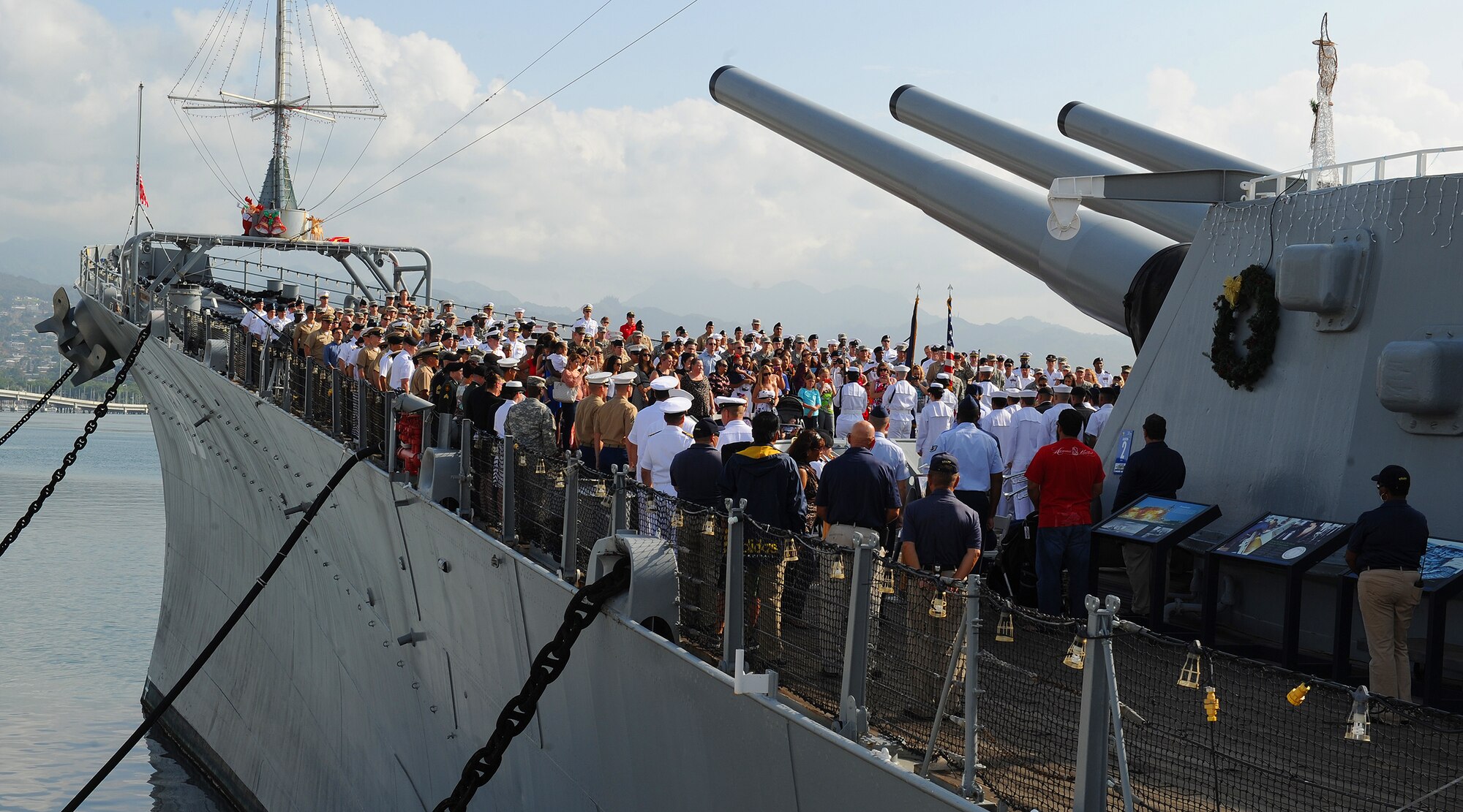 More than 50 joint service members along with their families, friends and coworkers assembled on the bow of the USS Missouri Memorial for a special mass re-enlistment ceremony, Pearl Harbor, Hawaii, Dec. 7, 2012. The ceremony also commemorated the 71st anniversary of the Pearl Harbor attacks, and paid honor to the more than 2,400 Americans who lost their lives on that tragic day. (U.S. Air Force photo/Tech. Sgt. Jerome S. Tayborn)