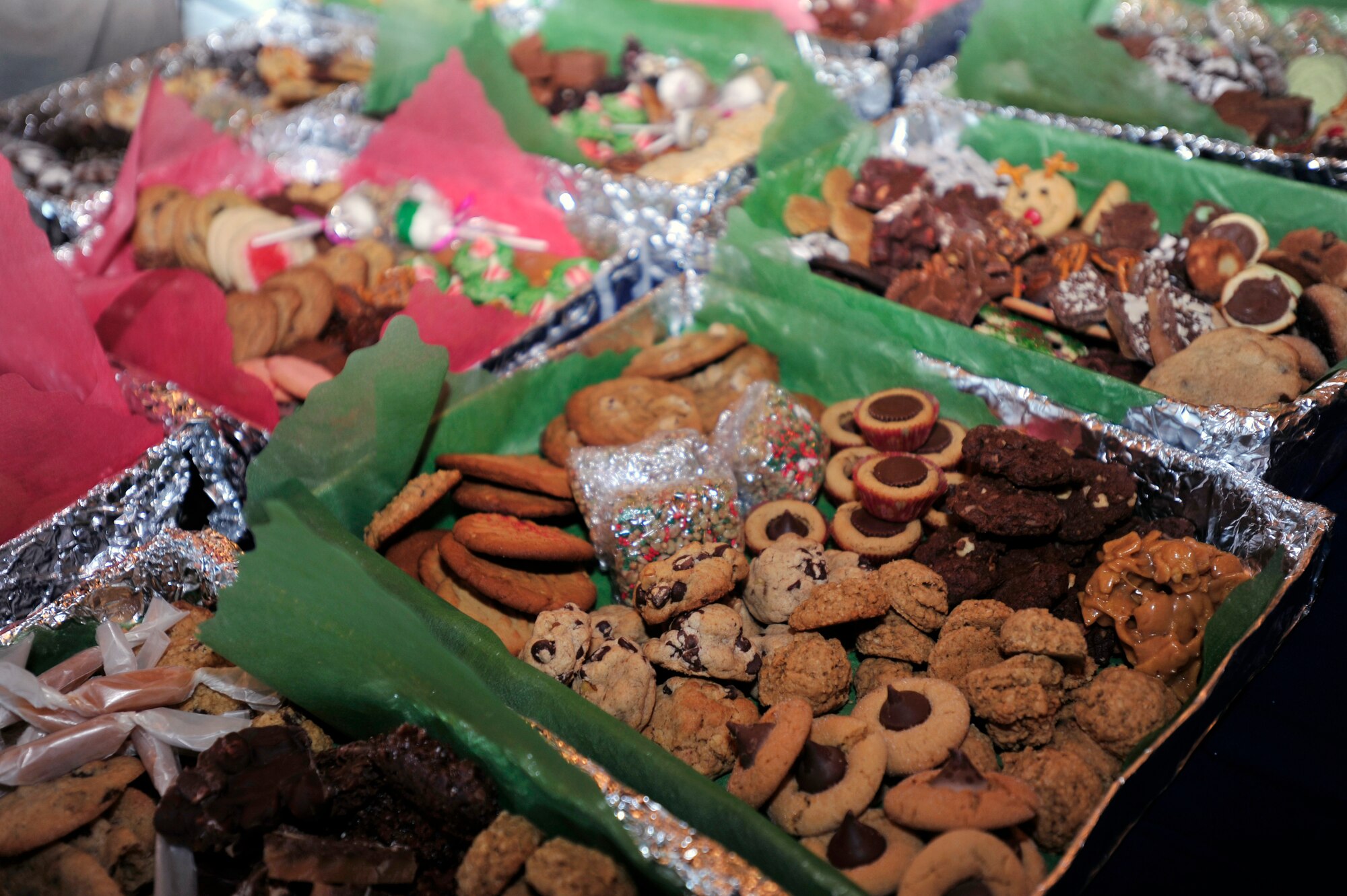 Thousands of homemade cookies donated by base community members were collected and packaged for delivery by officer and enlisted spouses through Operation Sweet Treat at the Osan Officers’ Club, Dec. 10, 2012. First sergeants delivered the cookies to unaccompanied service members at work. (U.S. Air Force photo/Airman 1st Class Alexis Siekert)