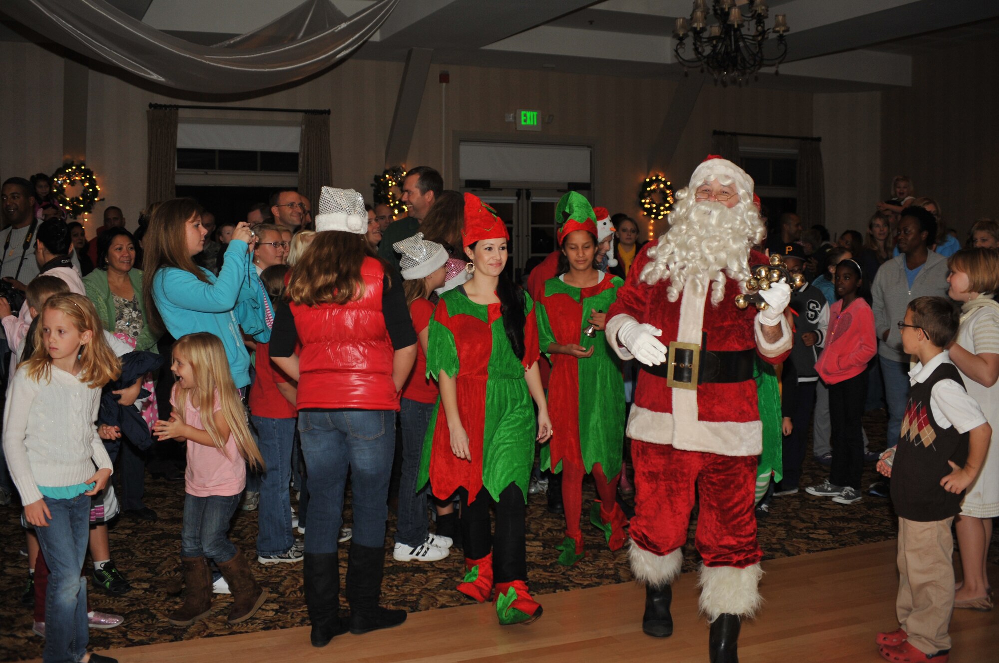 Santa Claus and his elves arrive for the annual base tree lighting, Nov. 30. Featuring music, food and a visit from St. Nick, the event kicks off the holidays at Los Angeles AFB. (Photo by Sarah Corrice) 