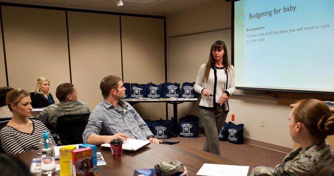 Daphne Perez, 28th Force Support Squadron Airman and Family Readiness Center community readiness consultant, informs participants about ways to save money and budget for a baby during a Bundles for Babies class at Ellsworth Air Force Base, S.D., Dec. 5, 2012. Many topics were discussed with expecting parents, including finances, child care, relationships, and nutrition. (U.S. Air Force photo by Airman 1st Class Alystria Maurer/Released)