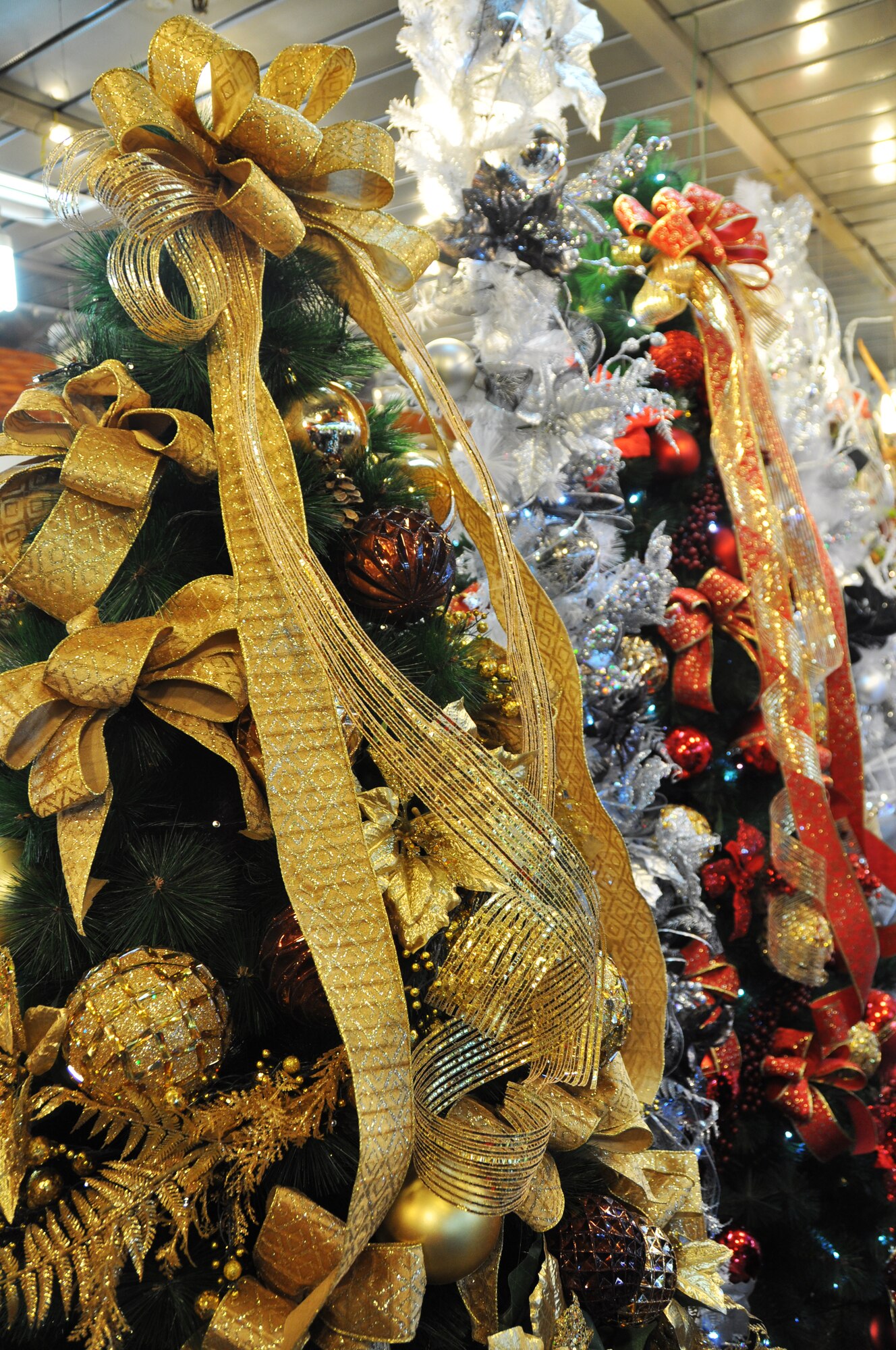 Pre-decorated Christmas trees in different colors are sold at the Holiday Shop, Flower Market at the Express Bus Terminal in Seoul, Republic of Korea. The market offers a varied selection of holiday decorations. (U.S. Air Force photo/Senior Airman Kristina Overton)