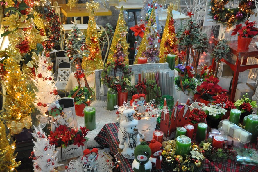 The Holiday Shop, Flower Market at the Express Bus Terminal offers an affordable selection of Christmas décor to include candles, trees and snowmen. Poinsettias in a variety of colors were also among the many different options. (U.S. Air Force photo/Senior Airman Kristina Overton)
