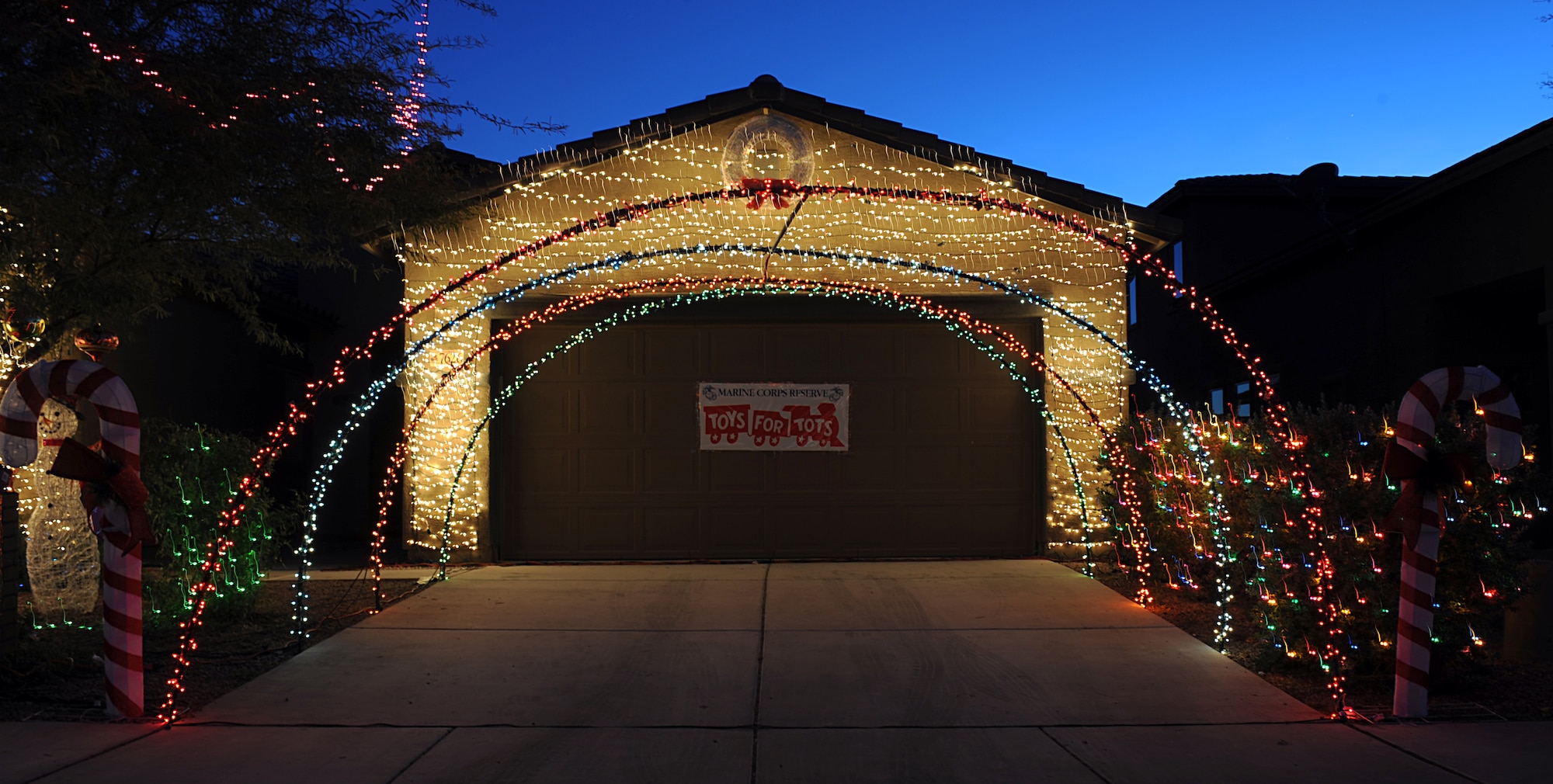 A Marine Toys for Tots sign hangs on the garage door of U.S. Air Force 1st Lt. Joshua Palochak's, 41st Electronic Combat Squadron, home in Tucson, Ariz., Dec. 1, 2012. Palochak uses his Christmas decoration to encourage people to donate to the Marine Toys for Tots Foundation. 2011 was the first year in almost five years that the foundation received enough toy donations. (U.S. Air Force photo by Senior Airman Timothy Moore/Released)