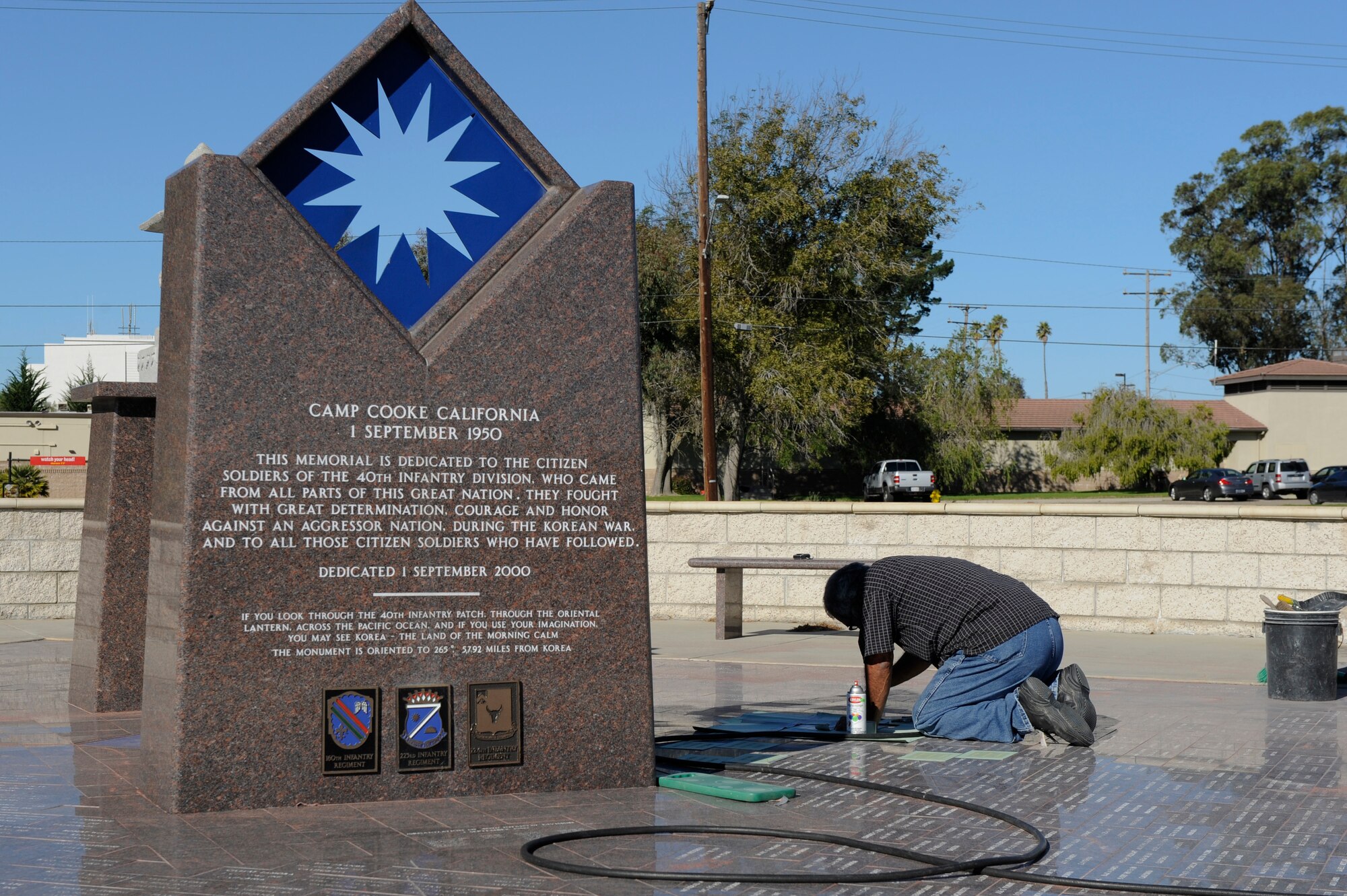 VANDENBERG AIR FORCE BASE, Calif. - Augie Ortiz, Santa Barbara Monumental Company certified memorialist, works on adding new names at the 40th Infantry Division Korean War Memorial here Monday, Dec. 10, 2012. The 40th lost nearly 400 soldiers in a year during the Korean War. To honor the fallen, names are etched into bricks at the memorial yearly. (U.S. Air Force photo/Airman Yvonne Morales) 
