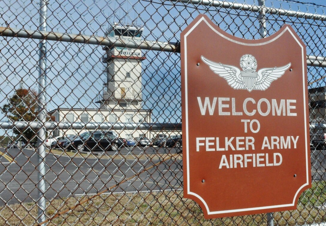 The air traffic control tower is seen through the flightline gate at Felker Army Airfield at Fort Eustis, Va., Nov. 7, 2012. Felker opened Dec. 10, 1954 as Felker Heliport, becoming the first military heliport in the world. (U.S. Air Force photo by Senior Airman Jason J. Brown/Released)