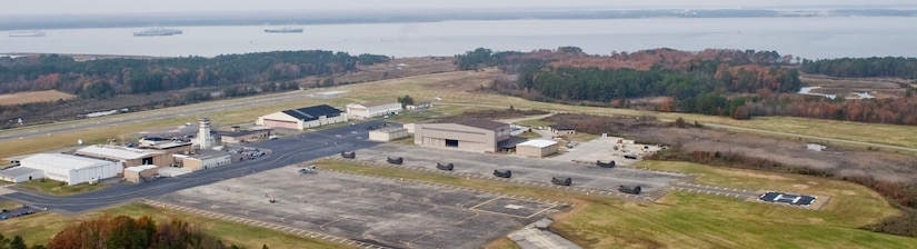 Felker Army Airfield at Fort Eustis, Va., is located along the westernmost edge of the installation, nestled along the shore of the James River, seen in the background of this aerial photograph. The airfield's unique placement makes it ideal for use by Navy helicopter squadrons based out of nearby Norfolk and Virginia Beach in training new pilots, as the southside Hampton Roads installations do not allow outlying fields for rotary-wing training. (U.S. Air Force photo by Staff Sgt. Wesley Farnsworth/Released)