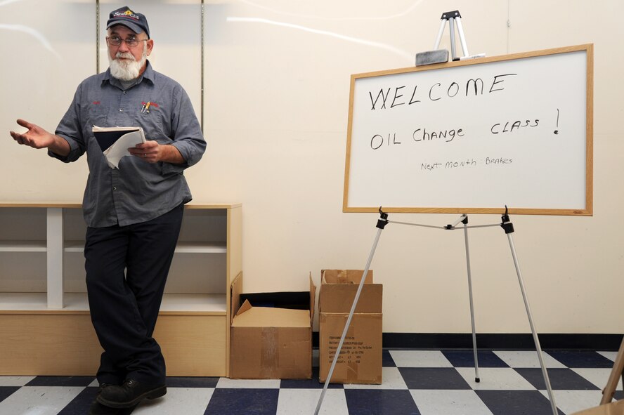 Keith Robertson, 27th Special Operations Force Support Squadron skills development manager, teaches a free class on oil change procedures at Cannon Air Force Base, N.M., Dec. 6, 2012.  The Auto Skills Center has recently begun monthly automotive care classes to better educate Airmen who would like to do their own vehicle maintenance.  (U.S. Air Force photo/Senior Airman Jette Carr)