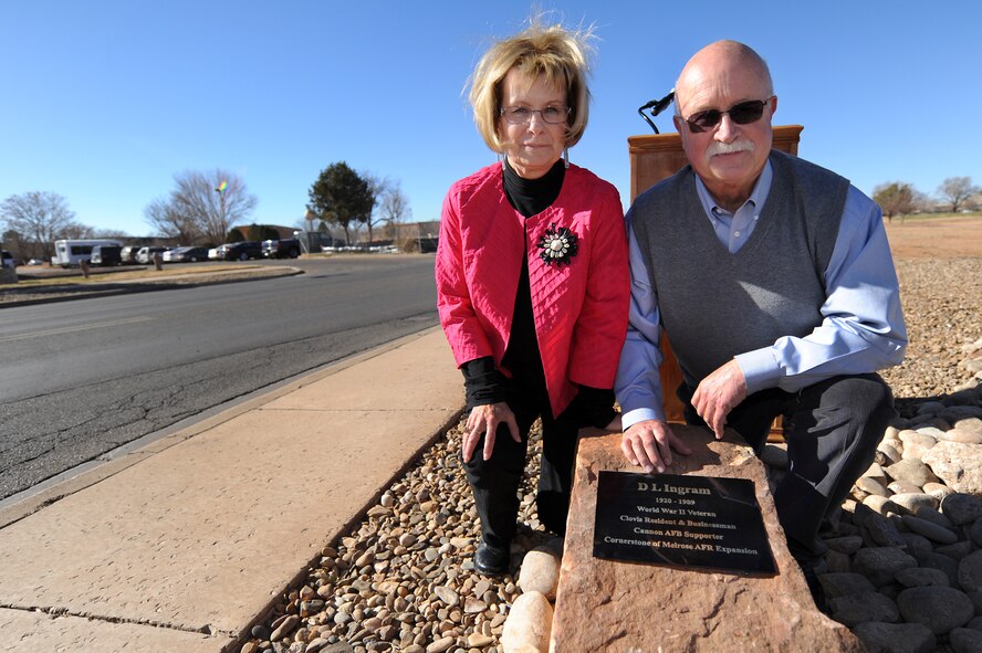 Keith Ingram and his wife, Peggy pose with a plaque honoring Ingram’s father, the late Darwin Legette Ingram, at the memorialization ceremony of D.L. Ingram Avenue at Cannon Air Force Base, N.M., Dec. 7, 2012. D.L. Ingram Avenue was relocated to a high-traffic area featuring many quality of life functions for Cannon Airmen and their families. (U.S. Air Force photo/Senior Airman Jette Carr)