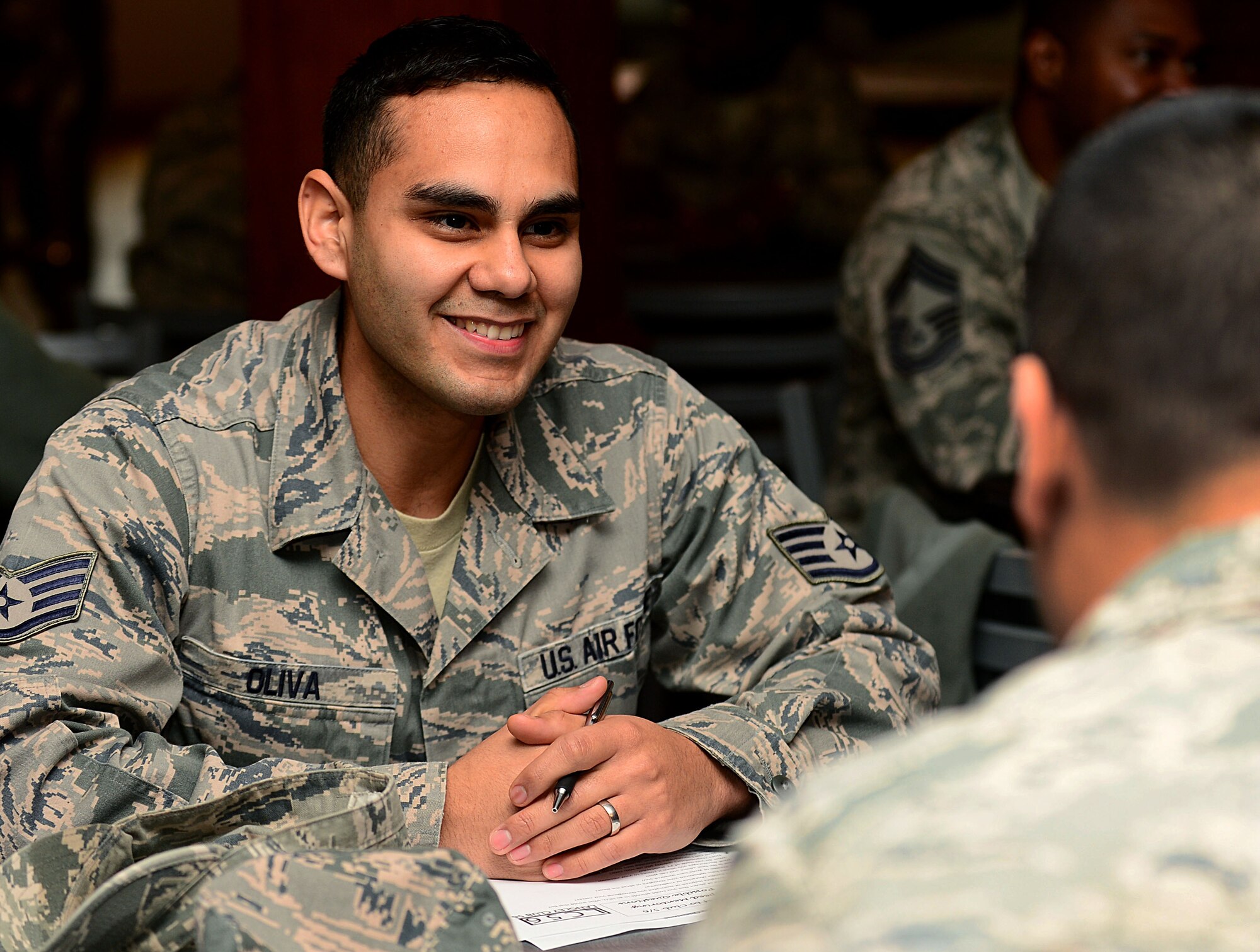 U.S. Air Force Staff Sgt. Andres Oliva, 633rd Logistics Readiness Squadron equipment accountability technician, receives a mentoring session from a chief master sergeant at Langley Air Force Base, Va., Dec. 7, 2012. By providing a location and having a structured system for Airmen to find their own mentors during a fast-paced event, speed mentoring solves a number of the disadvantages that come with formal mentoring sessions. (U.S. Air Force photo by Airman 1st Class Kayla Newman/Released)