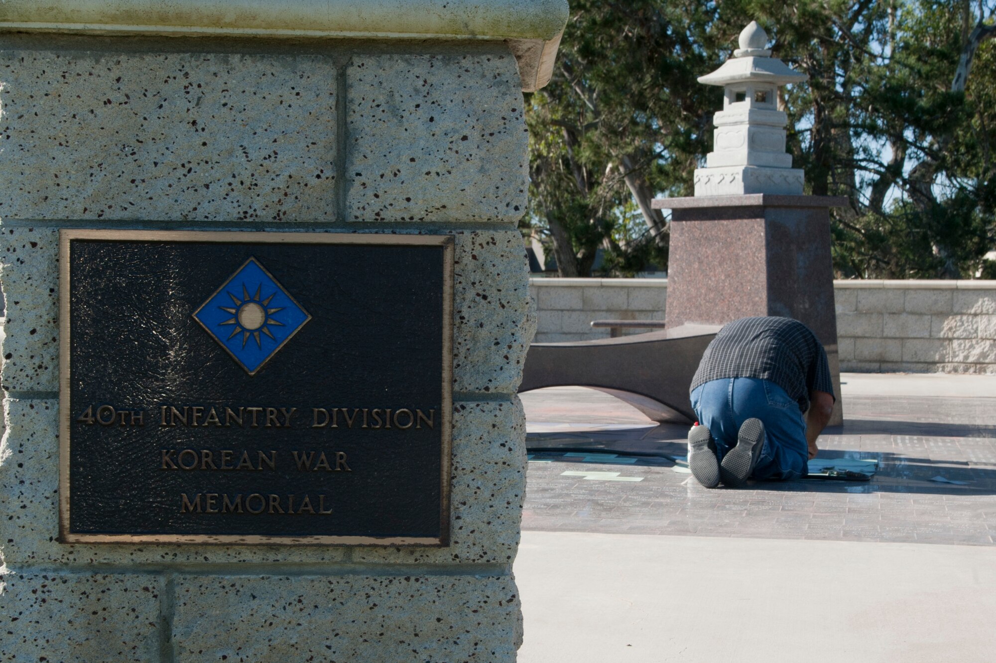VANDENBERG AIR FORCE BASE, Calif. –Augie Ortiz, Santa Barbara Monumental Company certified memorialist, sandblasts names into the marble bricks at the 40th Infantry Division Korean War Memorial here Monday, Dec. 10, 2012. The 40th lost nearly 400 soldiers in a year. To honor the fallen, names are etched into bricks at the memorial yearly. (U.S. Air Force photo/Senior Airman Lael Huss)