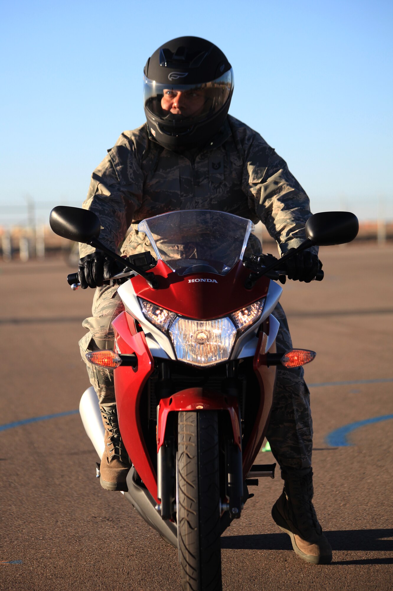 An Air Commando practices breaking during the Motorcycle Safety Foundation’s Beginner Rider Course at Cannon Air Force Base, N.M., Dec. 7, 2012.  The base recently purchased 13 new motorcycles for the class in order to offer riders a chance to sample the bike they prefer while learning the skills of a safe and responsible driver. (U.S. Air Force photo/Senior Airman Jette Carr)