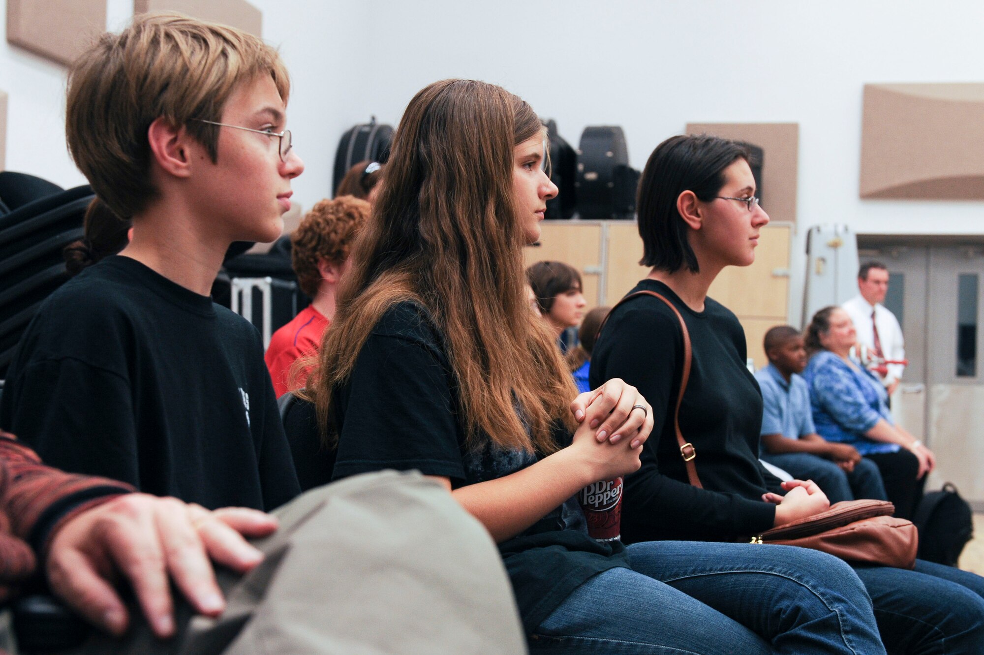 Students from York High School listen as the U.S. Air Force Heritage of America band rehearses at Langley Air Force Base, Va., Dec. 3, 2012. The students also had the opportunity to speak to band members who play the same instruments. (U.S. Air Force photo by Staff Sgt. Ciara Wymbs/Released)