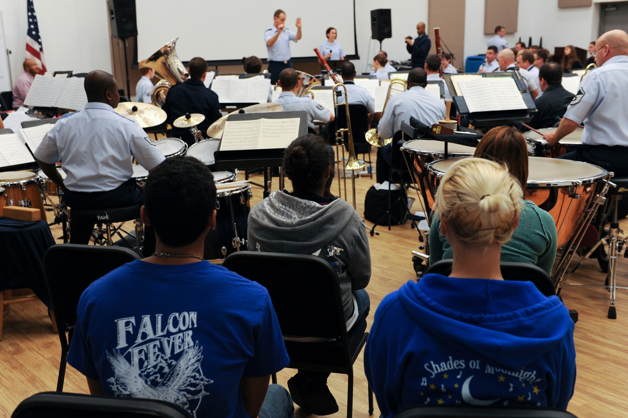 Students from York High School listen as the U.S. Air Force Heritage of America band rehearses at Langley Air Force Base, Va., Dec. 3, 2012. The students were on base to experience the daily routine of Airman musicians. (U.S. Air Force photo by Staff Sgt. Ciara Wymbs/Released)