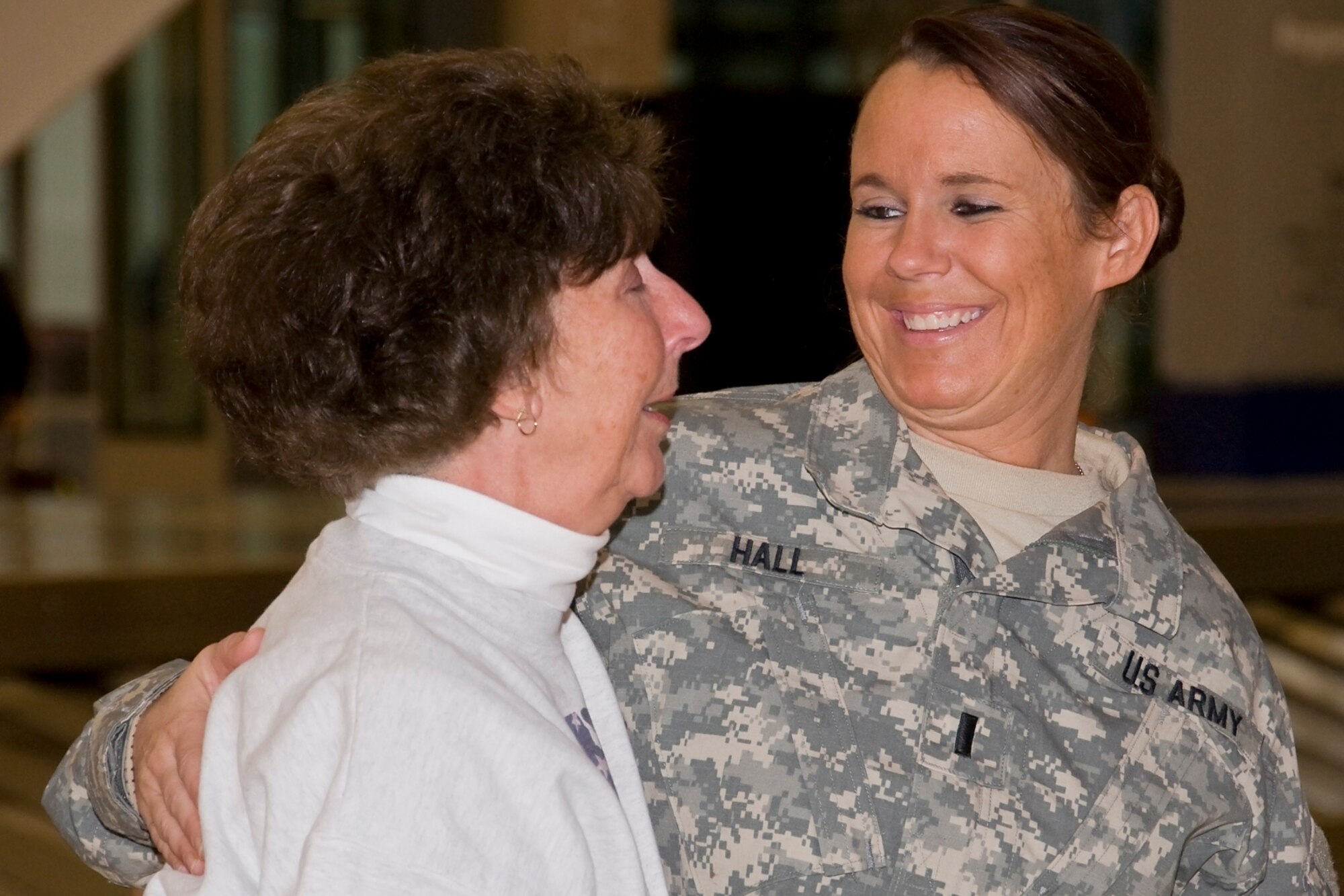 GRISSOM AIR RESERVE BASE, Ind -- 1st Lt. Michelle Hall, 316th Psychological Operations Company, comforts her mother, Viki Gostineau, just before preparing to board an aircraft at Indianapolis International Airport Dec. 7. Twenty four Soldiers from the 316th PSYOP Co. left Indianapolis to conduct additional training at Fort Dix, N.J., as they prepare for a 10-month deployment to the Horn of Africa in support of Operation Enduring Freedom. (U.S. Air Force photo/Staff Sgt. Ben Mota)