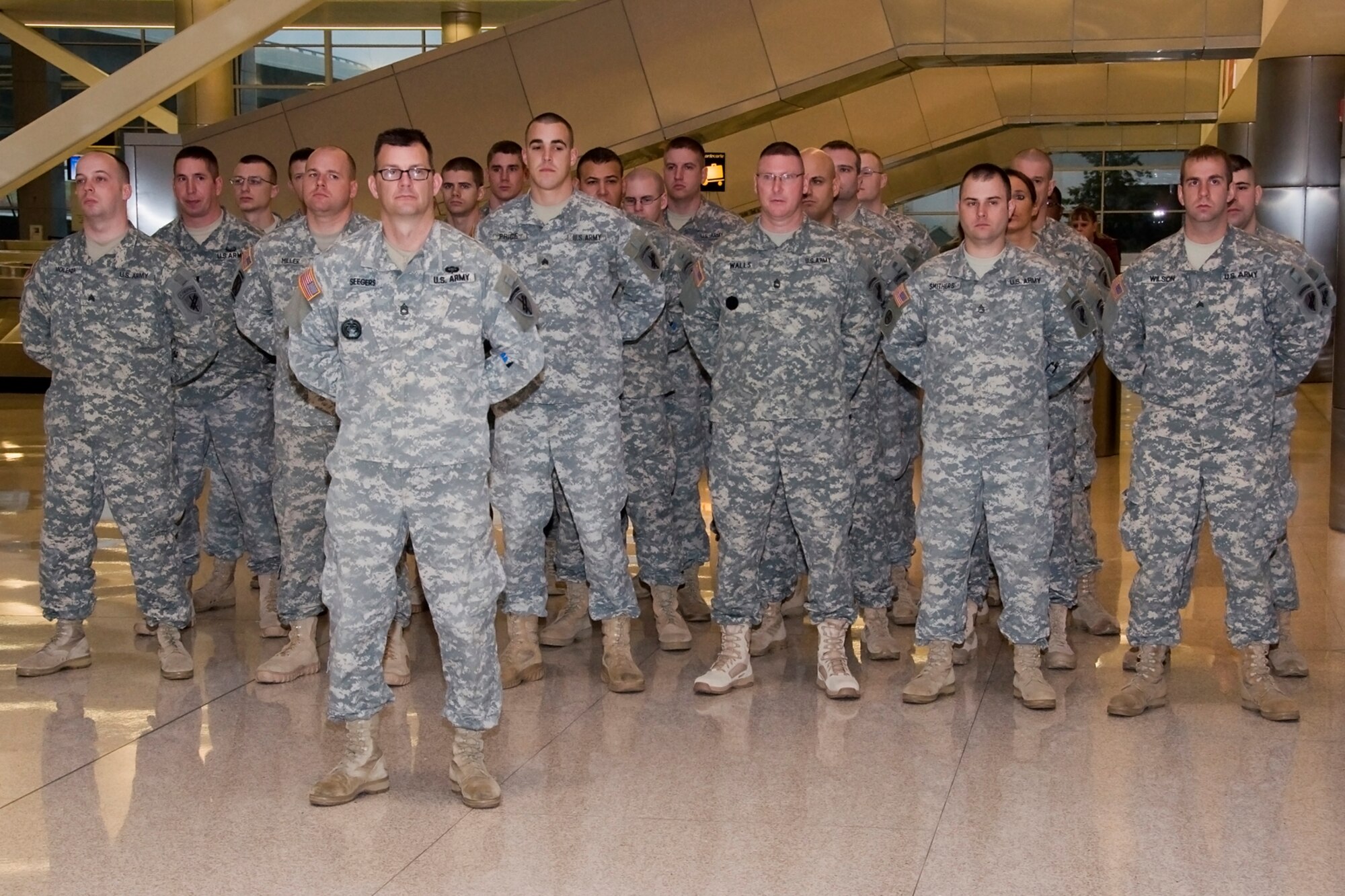GRISSOM AIR RESERVE BASE, Ind. -- Soldiers from the 316th Psychological Operations Company stand in formation during a departure ceremony held at Indianapolis International Airport Dec. 7. The Army Reserve Soldiers were activated for a deployment to Africa in support of Operation Enduring Freedom. (U.S. Air Force photo/Staff Sgt. Ben Mota)