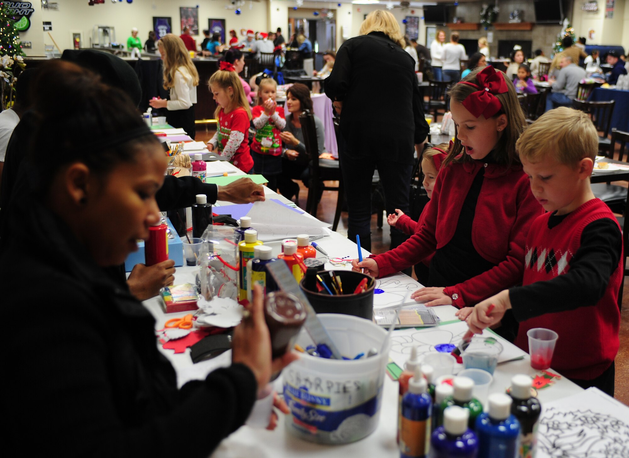 Children create holiday ornaments during Breakfast with Santa at Cannon Air Force Base, N.M.,  Dec. 8, 2012. The event was held at the Drop Zone and included breakfast, craft projects and a chance for the children to give Santa their Christmas wish lists. (U.S. Air Force photo/Airman 1st Class Ericka Engblom)