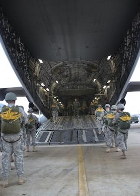 Paratroopers board a C-17 aircraft during the 15th Annual Randy Oler Memorial Operation Toy Drop, hosted by a U.S. Army Reserve unit, The U.S. Army Civil Affairs & Psychological Operations Command (Airborne), Dec. 7, 2012, at Pope Field, N.C. Operation Toy Drop is the world's largest combined airborne operation and allows soldiers the opportunity to help less fortunate children everywhere receive toys for the holidays.
(U.S. Army photo/Staff Sgt. Sharilyn Wells)