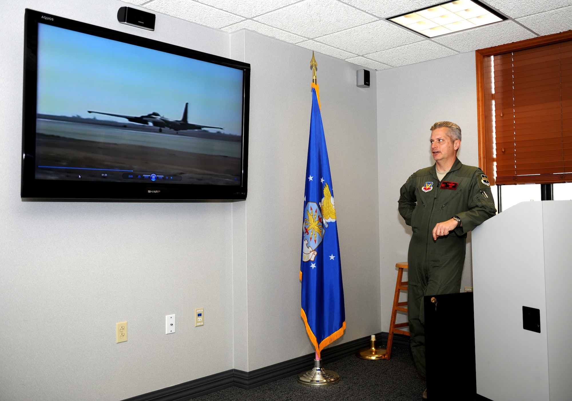 Lt. Col Stephen Rodriguez, commander of the 1st Reconnaissance Squadron shows video on pilots training on the U-2 during the recruiting presentation on the U-2.  Beale AFB is looking for officers with professionalism and flying skills necessary to pilot the U-2 "Dragon Lady."  (U.S. Air Force photo/Staff Sgt. Maria Bowman)