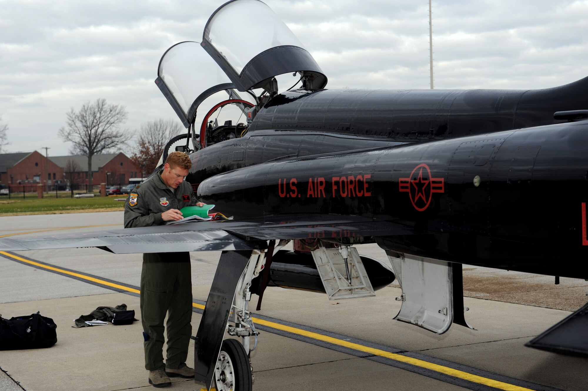 Maj. Eric, a pilot  in the 1st Reconnaissance Squadron, checks to see how much gas the plane has as he prepares the T-38 Talon for flight to McConnell Air Force Base to do recruiting presentation.  Beale AFB is looking for officers with professionalism and flying skills necessary to pilot the U-2 "Dragon Lady."  (U.S. Air Force photo/Staff Sgt. Maria Bowman)