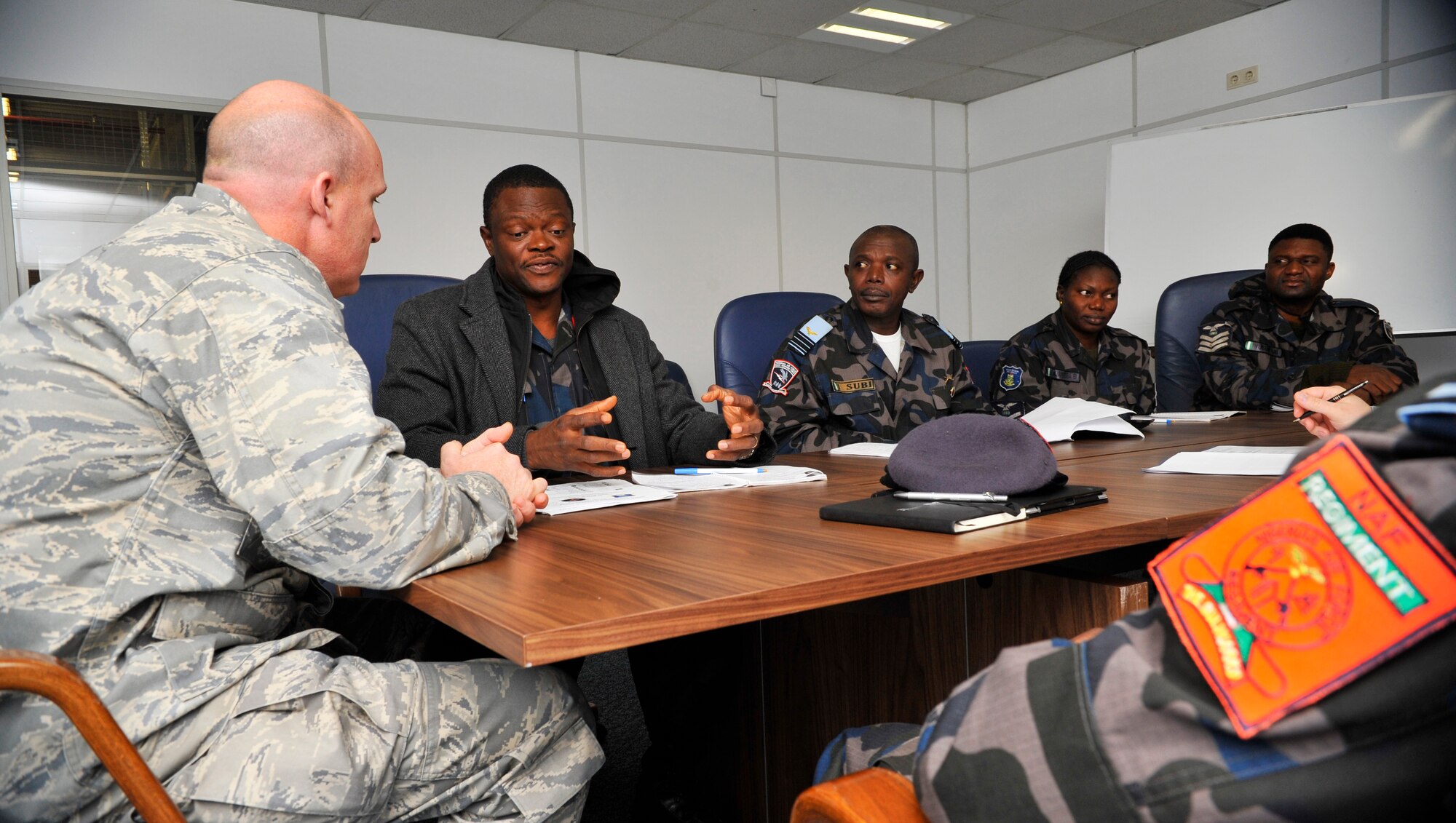 Five members of the Nigerian air force visit with Lt. Col. Robert Waarvik, 435th Contingency Response Group vice commander, following a three-day tour of the CRG, Dec. 6, 2012 at Ramstein Air Base, Germany. The visit to CRG was to help gain a better understanding of their construct, capabilities and employment. With these partnerships, the United States is able to teach and learn new mission techniques from counterparts from other nations. (U.S. Air Force photo/Tech. Sgt. Tyrona Lawson)