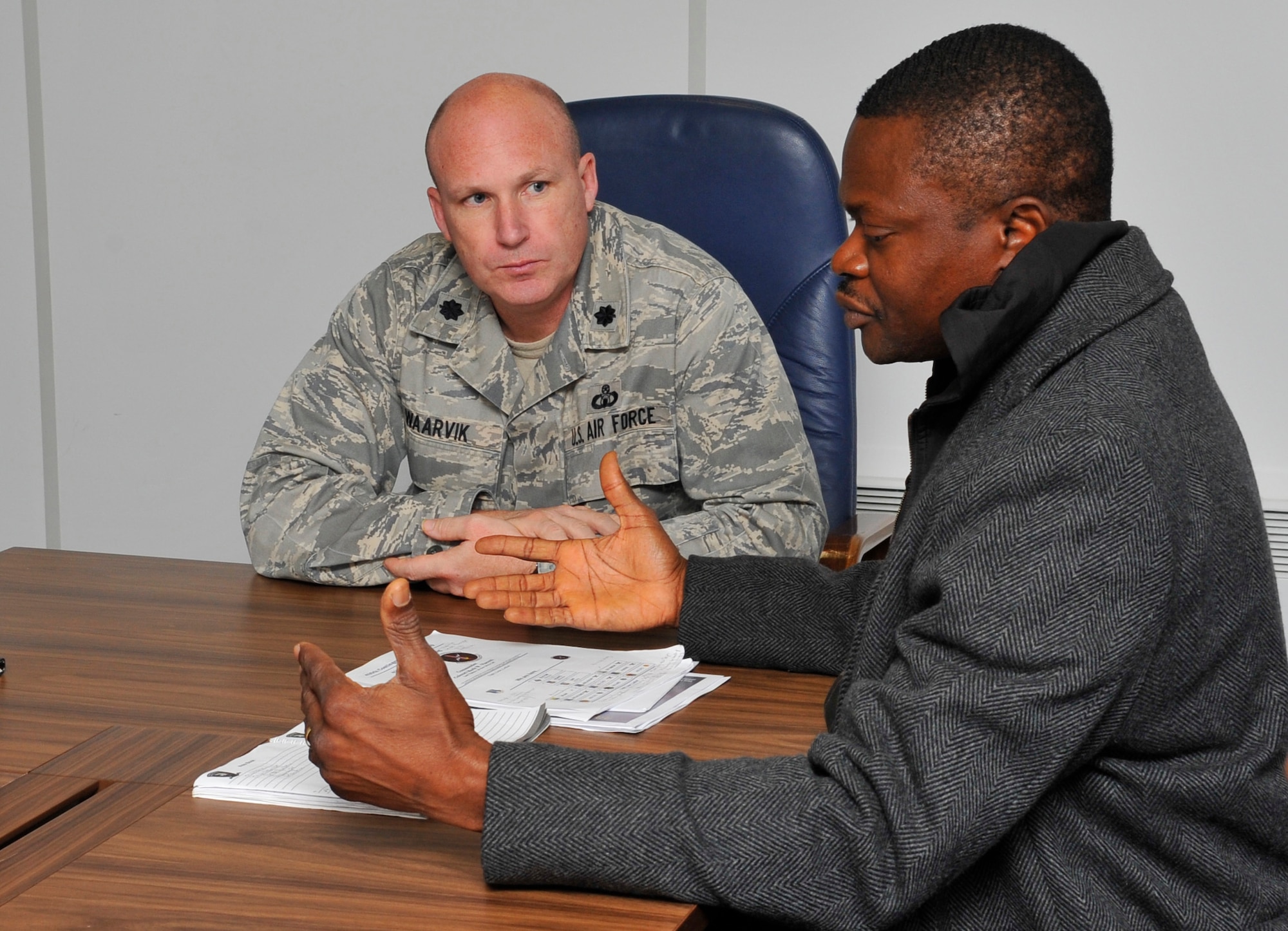 Nigerian Air Force Air Commodore Bernard U. Chiobi, speaks with Lt. Col. Robert Waarvik, 435th Contingency Response Group vice commander, following a three-day tour of the CRG, Dec. 6, 2012, at Ramstein Air Base, Germany. Five members of the Nigerian air force quick response force visited CRG to gain a better understanding of their construct, capabilities, and employment. With these partnerships, the United States is able to teach and learn new mission techniques from counterparts from other nations. (U.S. Air Force photo/Tech. Sgt. Tyrona Lawson)