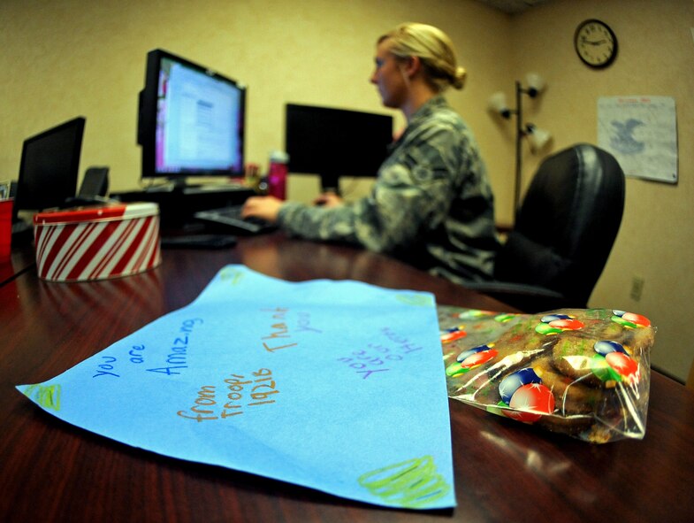 A thank you card and a bag of cookies sit on a dorm resident's desk on Barksdale Air Force Base, La., Dec. 5. More than 800 dorm residents received cookie packages as part of an annual drive to boost morale during the holidays. (U.S. Air Force photo/Senior Airman Micaiah Anthony)