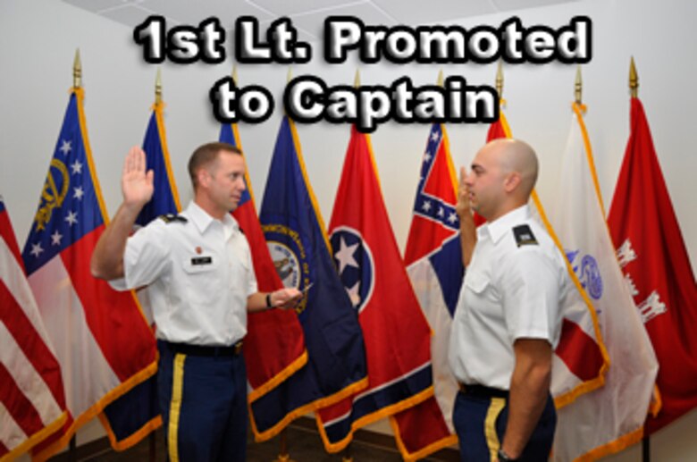 Lt. Col. James A. DeLapp, left, U.S. Army Corps of Engineers Nashville District commander, administers the Oath of Office to newly promoted Capt. Corey. T. Wolff Dec. 7, 2012. A native of Chatham, Ohio, Wolff is a 2009 West Point graduate, combat veteran of Afghanistan, and presently serves as project officer and quality assurance representative on the Cheatham Lock and Resource Management buildings contract in Ashland City, Tenn. (USACE photo by Fred Tucker)