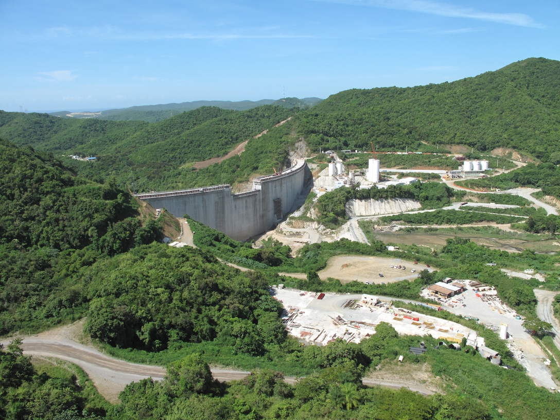 A view of Portugues Dam as it rises above the valley near the Corps’ office north of Ponce, Puerto Rico.  The dam is expected to be complete by September 2013. Photo courtesy Pablo Vázquez-Ruiz.   