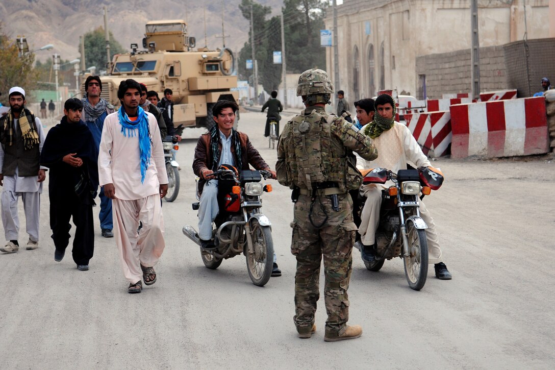 U.S. Army Sgt. Calixto Inot provides security during a key leader engagement in Farah City, Afghanistan, Dec. 5, 2012. Inot is assigned to Provincial Reconstruction Team Farah.