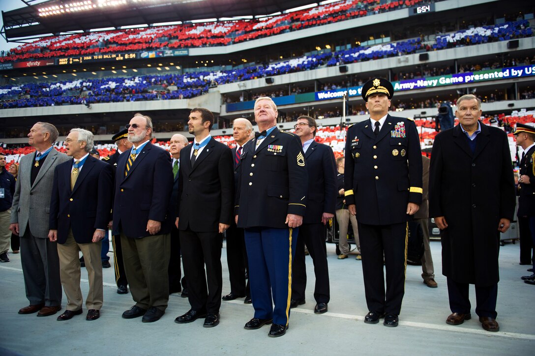 Left to right in the front row, Medal of Honor recipients Walter Joseph Marm, Jr., Jack H. Jacobs, Brian Miles Thacker, Salvatore Giunta, and Sammy L. Davis attend the Army-Navy football game at Lincoln Financial Field in Philadelphia, Dec. 8, 2012. Standing on the second row left to right: Undersecretary of the Army Joseph Westphal, Vice President Joe Biden, Deputy Defense Secretary Ashton B. Carter and Army Chief of Staff Ray Odierno.