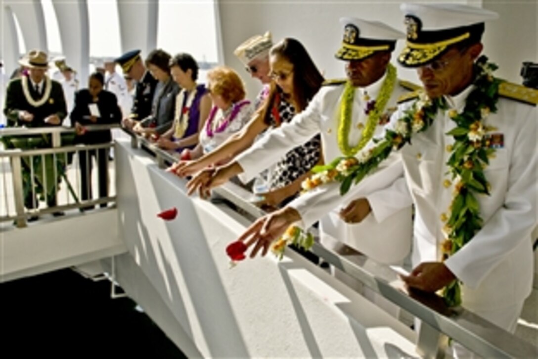 U.S. Navy Adm. Cecil Haney, commander of U.S. Pacific Fleet, right, and Rear Adm. Frank Ponds commander of Navy Region Hawaii, left, gathered with Pearl Harbor survivors and others at the  at the World War II Valor in the Pacific National Monument, in Honolulu, Dec. 7, 2012, to present a floral tribute to those killed and wounded in the Japanese attack on Pearl Harbor 71 years ago. 

