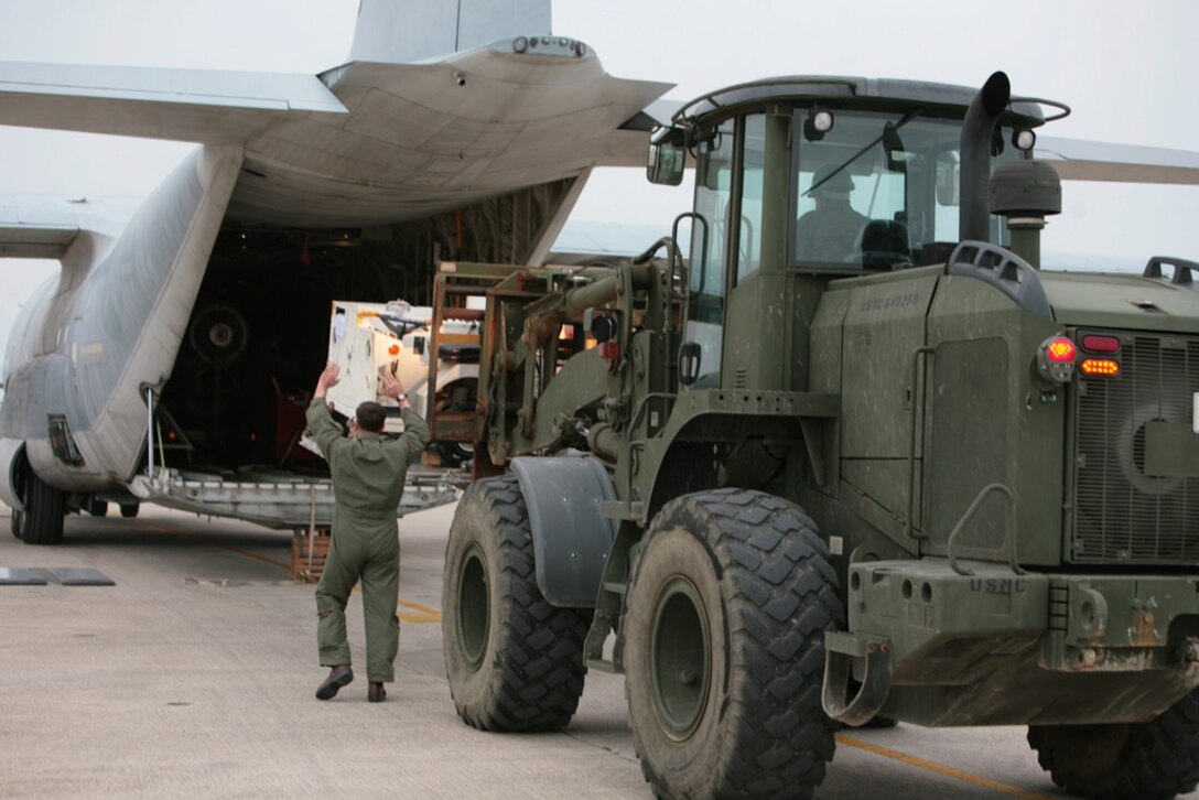 Marines load a KC-130J Hercules aircraft at Marine Corps Air Station Futenma bound for the Republic of the Philippines Dec. 8 to assist in humanitarian assistance and disaster relief efforts in the wake of Typhoon Bopha. The aircraft provides the lift capacity and capability to transport personnel and relief supplies to areas where they are needed. Personnel with 3rd Marine Expeditionary Brigade, already located in the Philippines and serving as the III Marine Expeditionary Force Forward Command Element, will help provide assistance as requested to areas affected by the typhoon in support of ongoing relief efforts by the Government of the Republic of the Philippines, the Armed Forces of the Philippines and the U.S. Agency for International Development. The aircraft and Marines are with Marine Aerial Refueler Transport Squadron 152, Marine Aircraft Group 36, 1st Marine Aircraft Wing, III MEF. (U.S. Marine Corps photo by Lance Cpl. Matthew Manning/Released)
