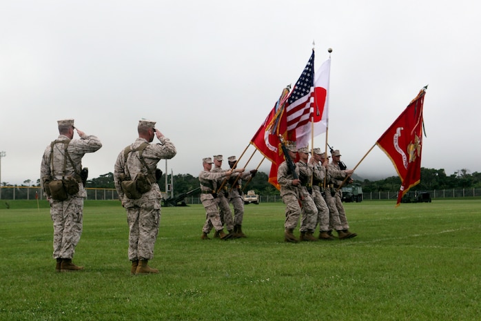 Colonel Andrew MacMannis (Left) and Col. John Merna (Right), salute as the colors pass during the pass in review portion of the 31st Marine Expeditionary Unit's change of command ceremony at Camp Hansen, June 1. MacMannis relinquished command to Merna after two distinguished years of leading expeditionary operations in the Asia Pacific, to include a pivotal role in the tsunami relief of Operation Tomadachi. The 31st MEU is the United States' force in readiness for the Asia-Pacific region.