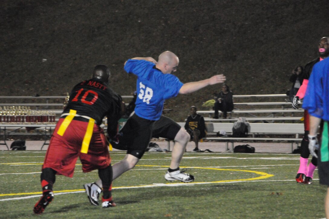 Kevin Rorabaugh, a player for Marine Helicopter Squadron 1's American League intramural flag football team, rushes forward despite having his flags snatched during the championship game at Butler Stadium on Dec. 10.