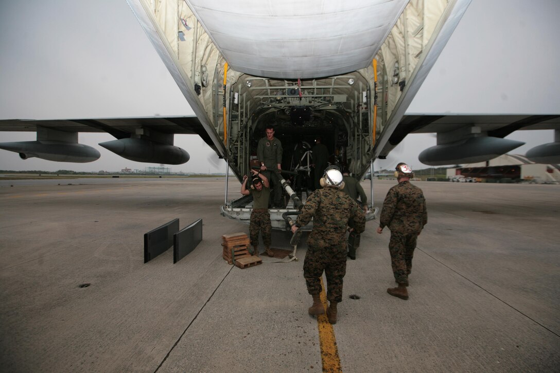 Marines load a KC-130J Hercules aircraft at Marine Corps Air Station Futenma bound for the Republic of the Philippines Dec. 8 to assist in humanitarian assistance and disaster relief efforts in the wake of Typhoon Bopha. The aircraft provides the lift capacity and capability to transport personnel and relief supplies to areas where they are needed. Personnel with 3rd Marine Expeditionary Brigade, already located in the Philippines and serving as the III Marine Expeditionary Force Forward Command Element, will help provide assistance as requested to areas affected by the typhoon in support of ongoing relief efforts by the Government of the Republic of the Philippines, the Armed Forces of the Philippines and the U.S. Agency for International Development. The aircraft and Marines are with Marine Aerial Refueler Transport Squadron 152, Marine Aircraft Group 36, 1st Marine Aircraft Wing, III MEF.