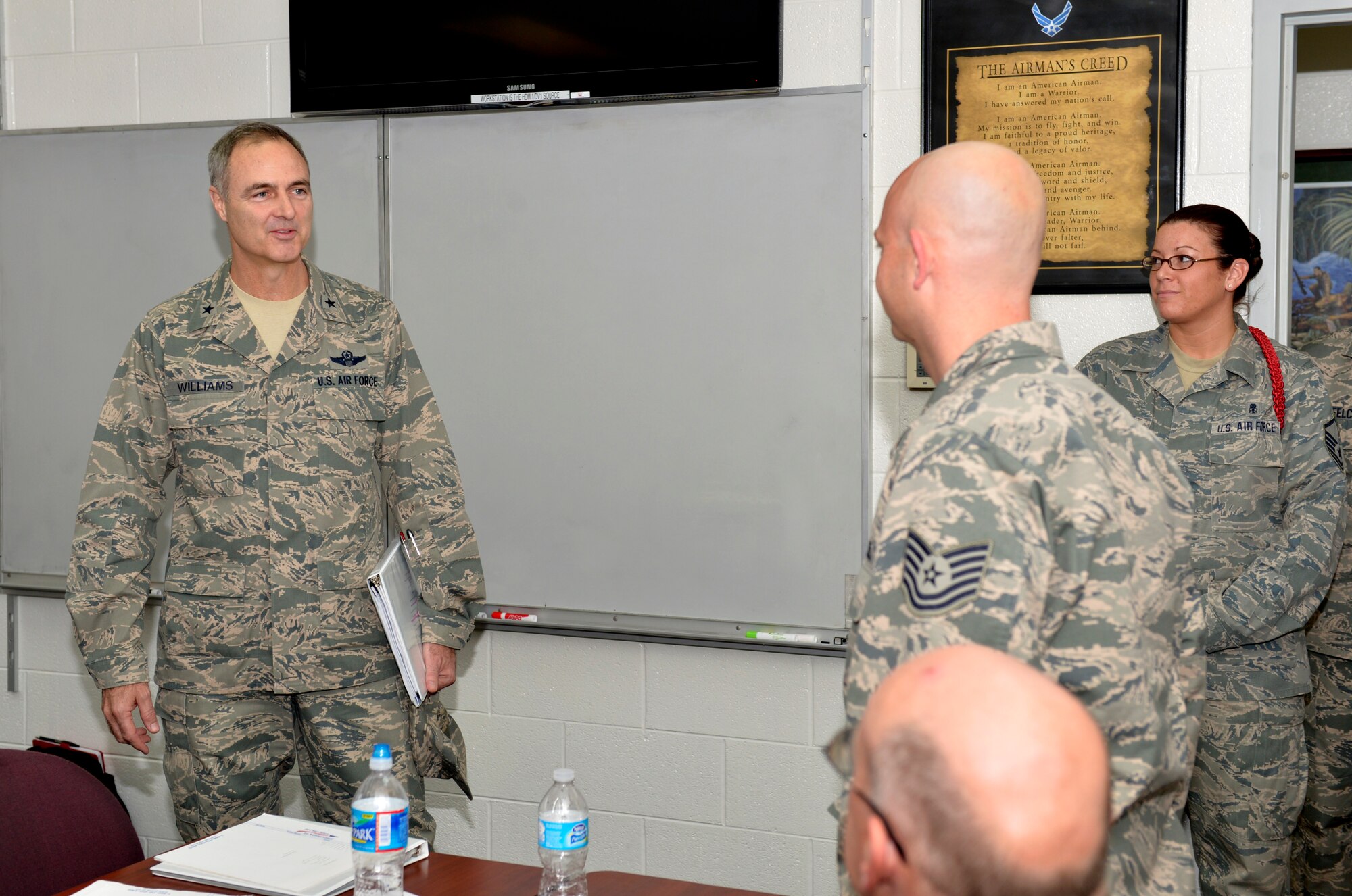 Brig. Gen. R. Scott Williams, Air National Guard Readiness Center commander, speaks with Tech. Sgt. Joseph Phair during a visit to the I.G. Brown Training and Education Center, McGhee Tyson Air National Guard Base, Tenn., Dec. 11, 2012. Phair, an aircraft fundamentals instructor assigned to Lackland Air Force Base, Texas, is at the Center attending the in-residence portion of the satellite non-commissioned officers’ academy course. (National Guard photo by Master Sgt. Kurt Skoglund/released)