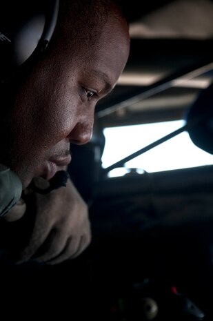 Tech. Sgt. Davie Hobbs, 384th Air Refueling Squadron boom operator, McConnell Air Force Base, Kan., scans for aircraft to refuel from the boom of a  KC-135 Stratotanker during a Mission Employment Phase exercise Dec. 9, 2012, over the Nevada Test and Training Range. The ME Phase exercise includes both day and night sorties and a number of aircraft types. (U.S. Air Force photo by Staff Sgt. Christopher Hubenthal)