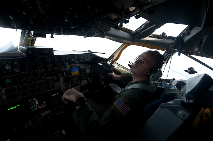 First Lt. Paul Hesser, 384th Air Refueling Squadron co-pilot, McConnell Air Force Base, Kan., helps pilot a KC-135 Stratotanker during a Mission Employment Phase exercise Dec. 9, 2012, over the Nevada Test and Training Range. ME Phase is the capstone, graduation exercise conducted by the U.S. Air Force Weapons School. (U.S. Air Force photo by Staff Sgt. Christopher Hubenthal)