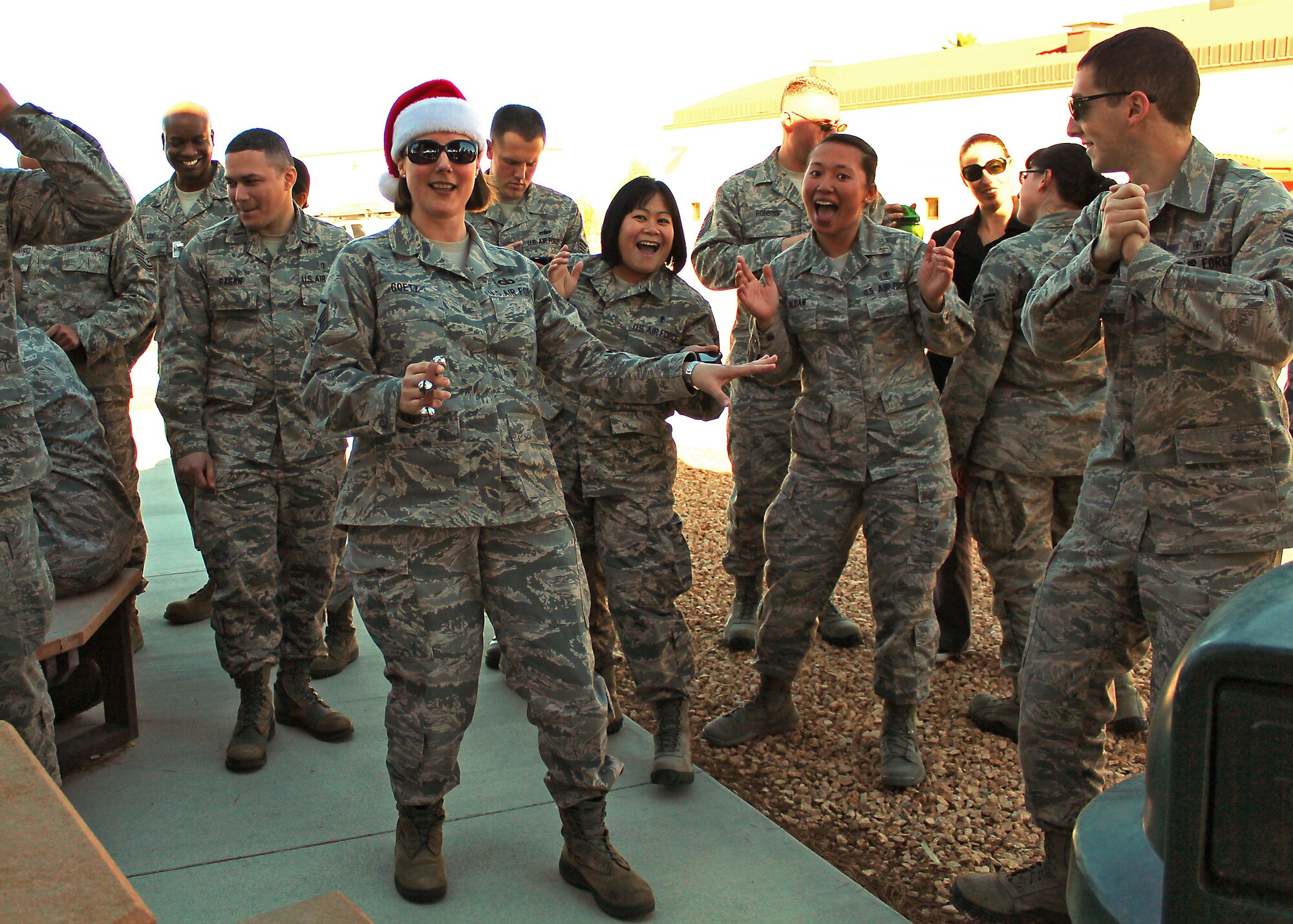 Master Sgt. Paula Goetz of Mobility sings and dances along with Airmen from the 412th Medical Group. According to the USAF Band of the Golden West's website, much like its name implies, the high-powered group travels extensively throughout California, Oregon, Washington, Idaho, and Nevada. Mobility regularly entertains crowds at professional sporting events such as the games of the Oakland Raiders, San Francisco 49ers and the Oakland A's. (U.S. Air Force photo by Melissa Buchanan)