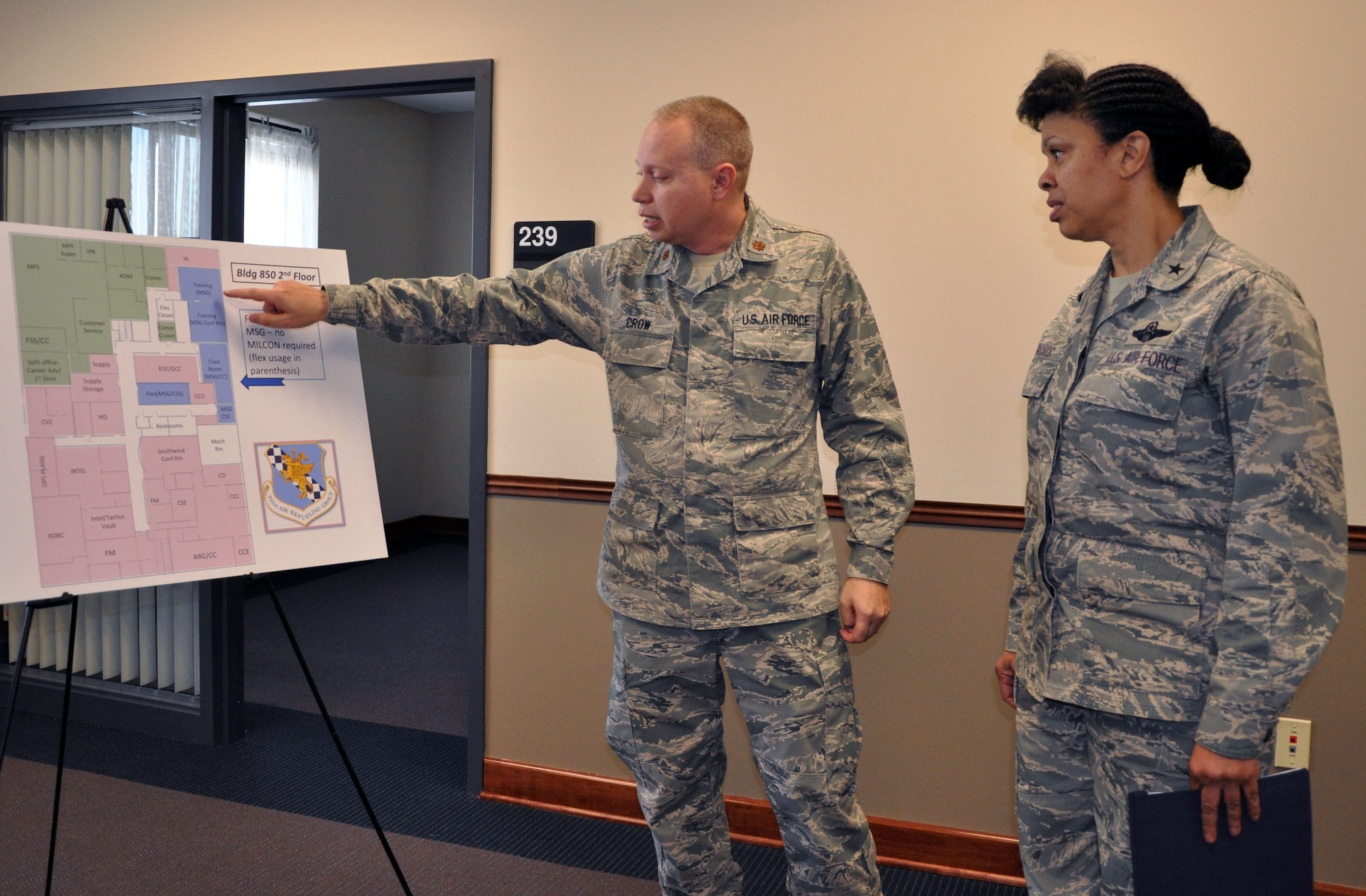 Maj. Doug Crow, 931st Air Refueling Group Process Manager, briefs Brig. Gen. Stayce Harris, Mobilization Assistant to the Commander, 18th Air Force, on the plans for the renovated 931st Air Refueling Group headquarters building at McConnell Air Force Base, Kan., Dec. 11, 2012.  Harris spent the day visiting with members of the 931st and receiving briefings from Group leadership. (U.S. Air Force photo by 1st Lt. Zach Anderson)