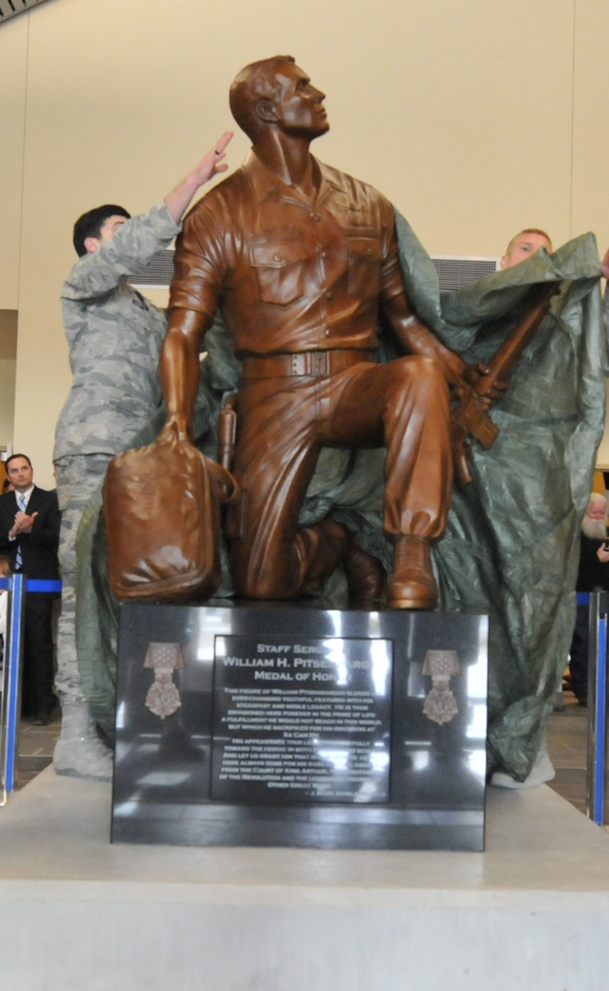 KIRTLAND AFB, N.M. -- The Detachment 1, 342nd Training Squadron conducted a dedication ceremony Dec. 6 in honor of Staff Sgt. William H. Pitsenbarger at the Guardian Angel Training Center. During the ceremony a sculpture of Pitsenbarger was unveiled. Pitsenbarger was an Air Force pararescueman who gave his life in 1966 defending a unit of soldiers in the Vietnam War. He was awarded the Air Force Cross, later upgraded to the Medal of Honor, becoming the first enlisted Airman to receive the medals posthumously.  (Photo by Todd Berenger)