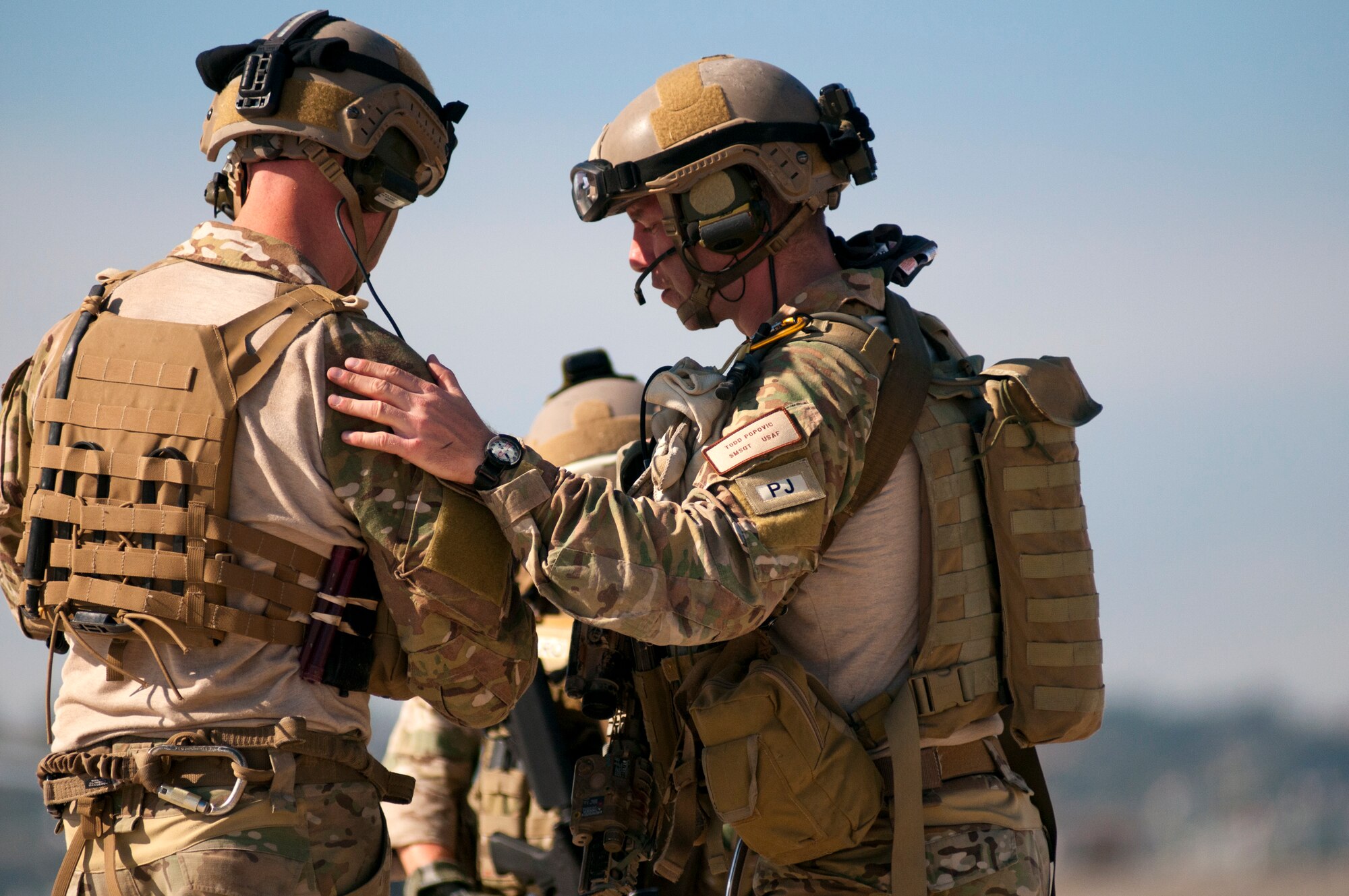 U.S. Air Force pararescuemen review their notes and plan of action on the flightline as a training mission commences during a Joint Task Force Exercise on Naval Air Station North Island. The operation is the first time Air Force Rescue forces have participated in a JTFEX and are directly supporting tactics techniques and procedures for Air-Sea Battle as it relates to personnel recovery. (U.S. Navy photo by Mass Communication Specialist 3rd Class Carlos M. Vazquez II/Released)