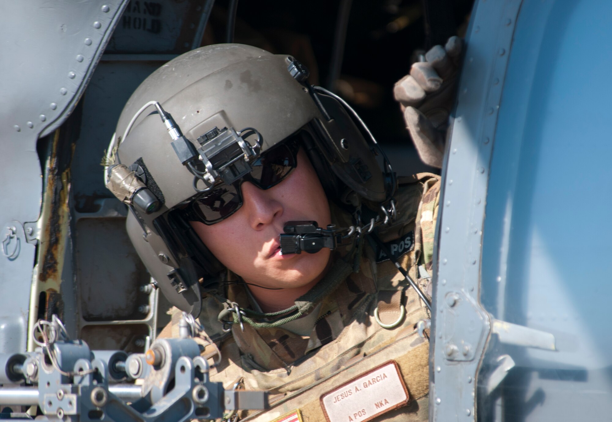 (Nov. 7, 2012) A U.S. Air Force Airman peers out the side of a HH-60 helicopter during a simulated personnel recovery operation as part of a Joint Task Force Exercise with the Navy on Naval Air Station North Island. The operation is the first time Air Force rescue forces have participated in a JTFEX and are directly supporting tactics, techniques and procedures for Air-Sea Battle as it relates to personnel recovery. (U.S. Navy photo by Mass Communication 2nd Class Dominique Pineiro/ Released)