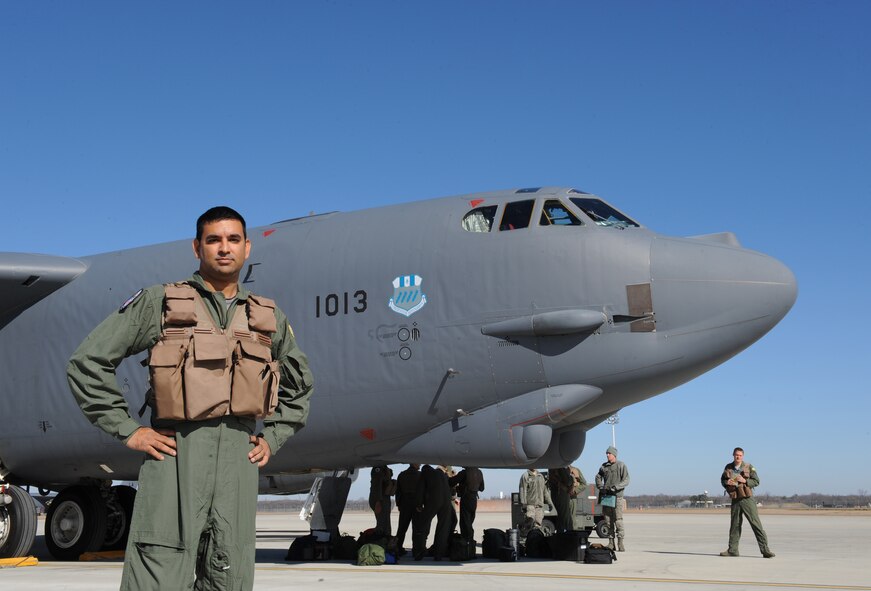 Sagar Pathak poses in front of a B-52H Stratofortress on Barksdale Air Force Base, La., Dec. 11. Pathak is an associated editor for the national aviation magazine "In-flight USA" and received an opportunity to fly inside a B-52. (U.S. Air Force photo/Airman 1st Class Benjamin Gonsier)
