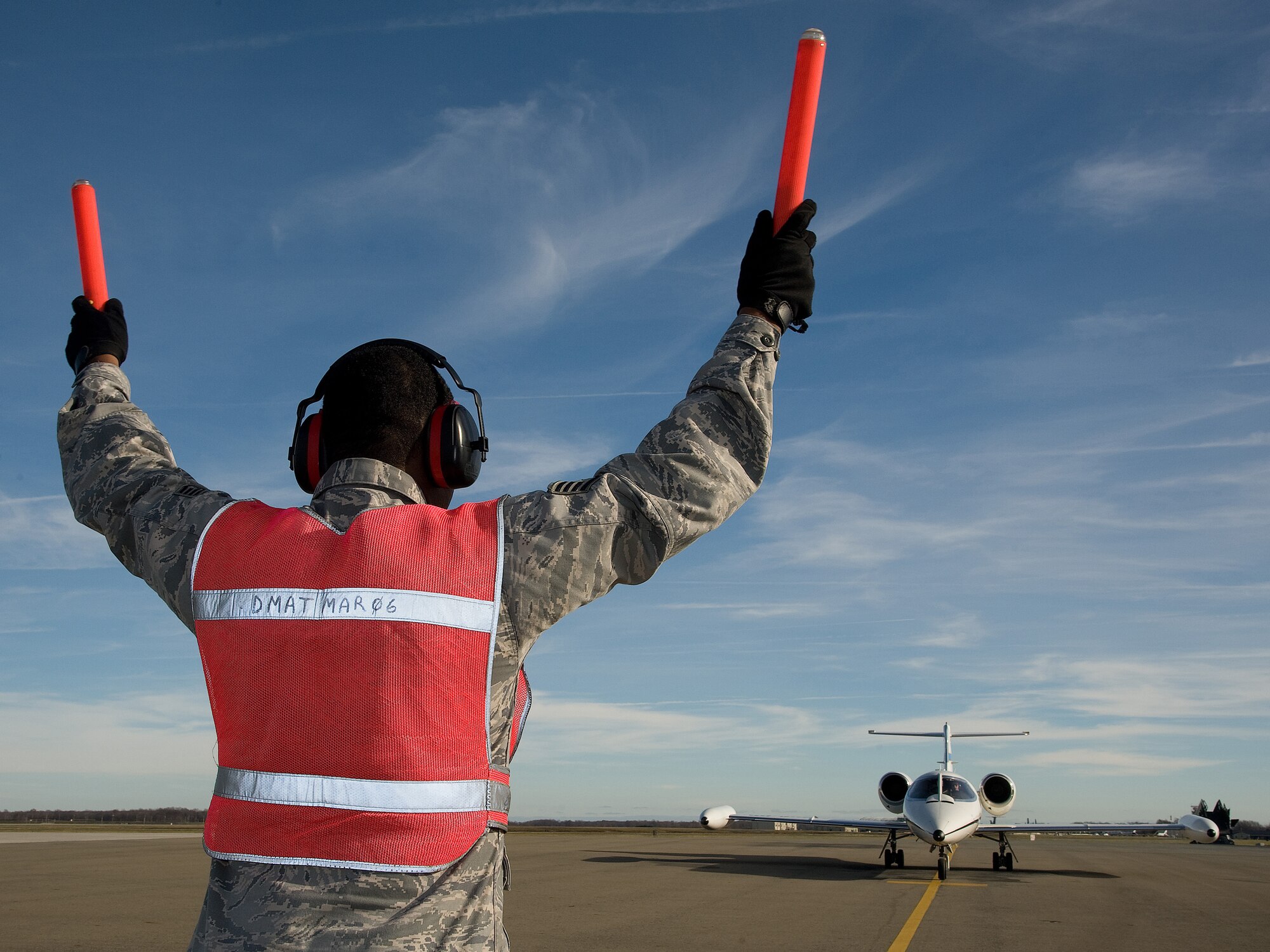 SSgt.  Aaron Young, 436th Aircraft Maintenance Squadron, marshals the C-21 aircraft carrying Gen. Paul J. Selva, Air Mobility commander, in to park Dec. 6, 2012, at Dover Air Force Base, Del.  Selva  visited the 436th Airlift Wing to introduce himself to Team Dover at an All Call during a tour of AMC wings throughout December. As commander of AMC, Selva leads all mobility air forces comprised of nearly 134,000 personnel from the active duty, Air National Guard , and Air Force Reserve. (U.S. Air Force photo by Greg L. Davis)