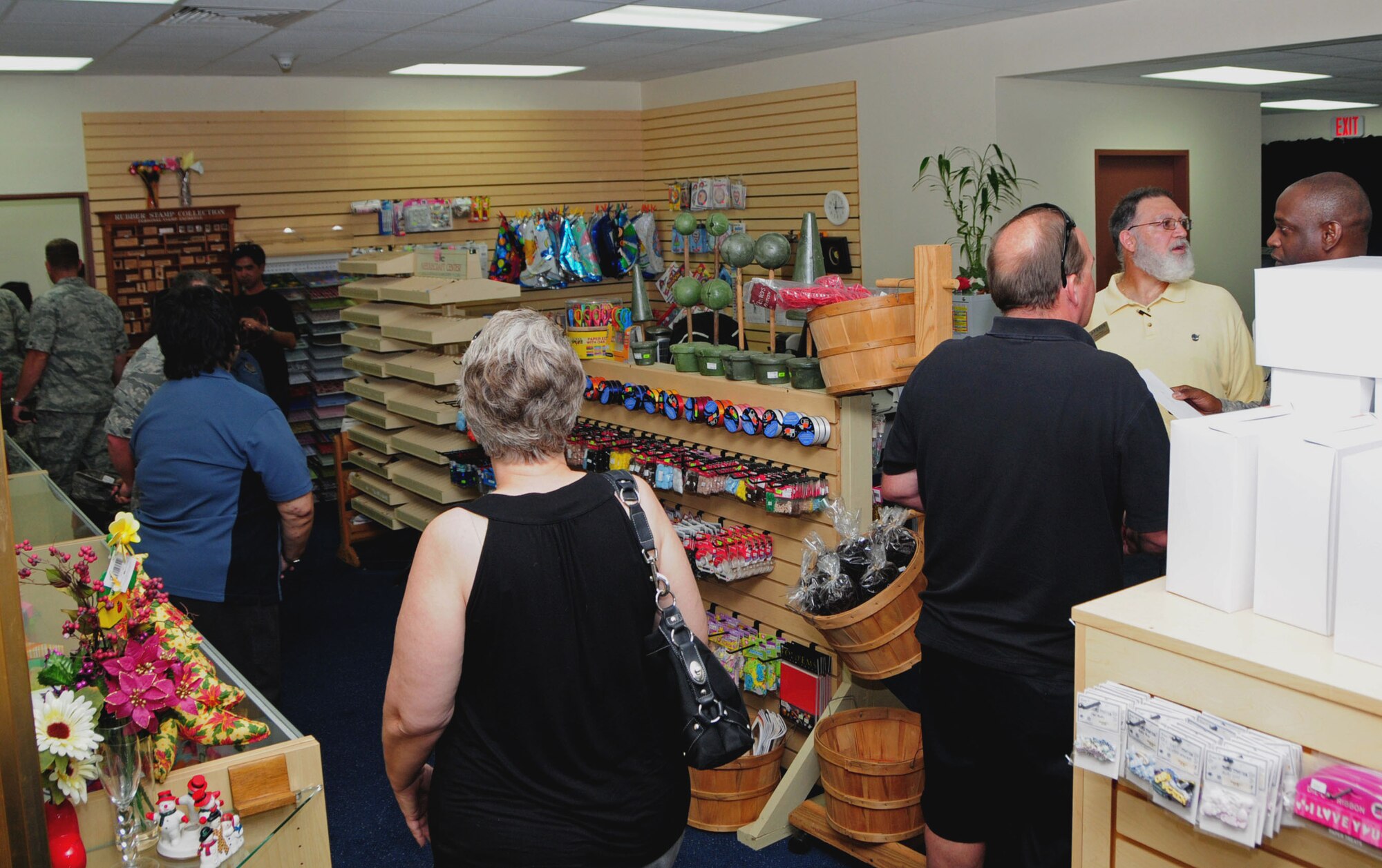 ANDERSEN AIR FORCE BASE, Guam -- Team Andersen members walk around and browse the merchandise of the new Arts and Crafts Center on Andersen Air Force Base, Guam, Dec. 7, 2012. The store is now located in the Plaza Arcade across from the Gecko Lanes bowling center. (U.S. Air Force photo/Airman 1st Class Marianique Santos/Released)