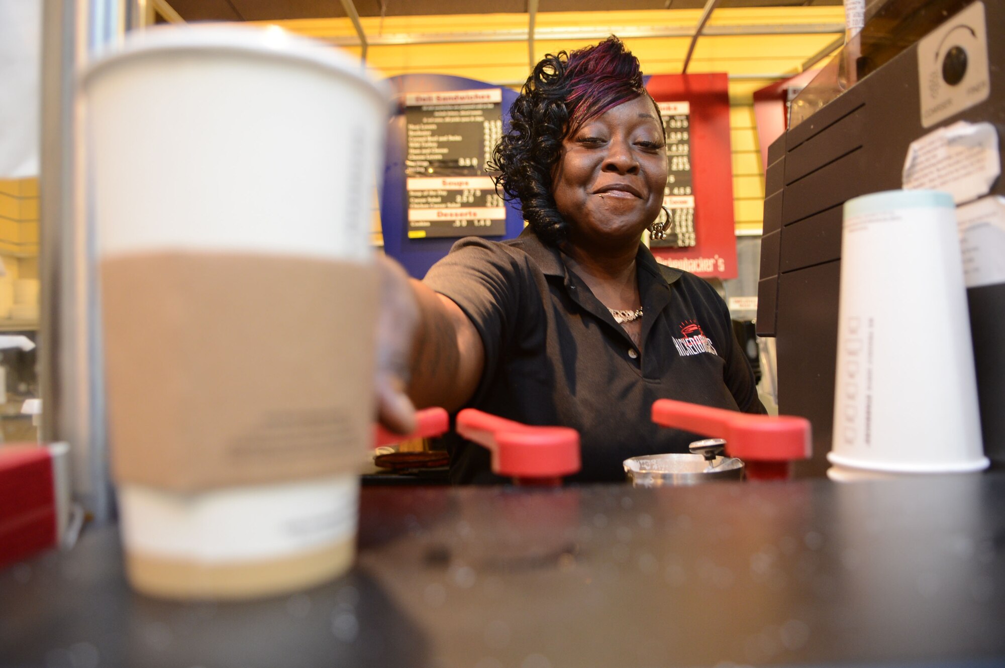Latonya Ludd, Rickenbackers barista, makes a coffee for a customer at Shaw Air Force Base, S.C., Dec. 10, 2012.  Ludd is the Shaw Spotlight for the week of Dec. 10 to Dec. 14. (U.S. Air Force photo by Airman Nicole Sikorski/Released)