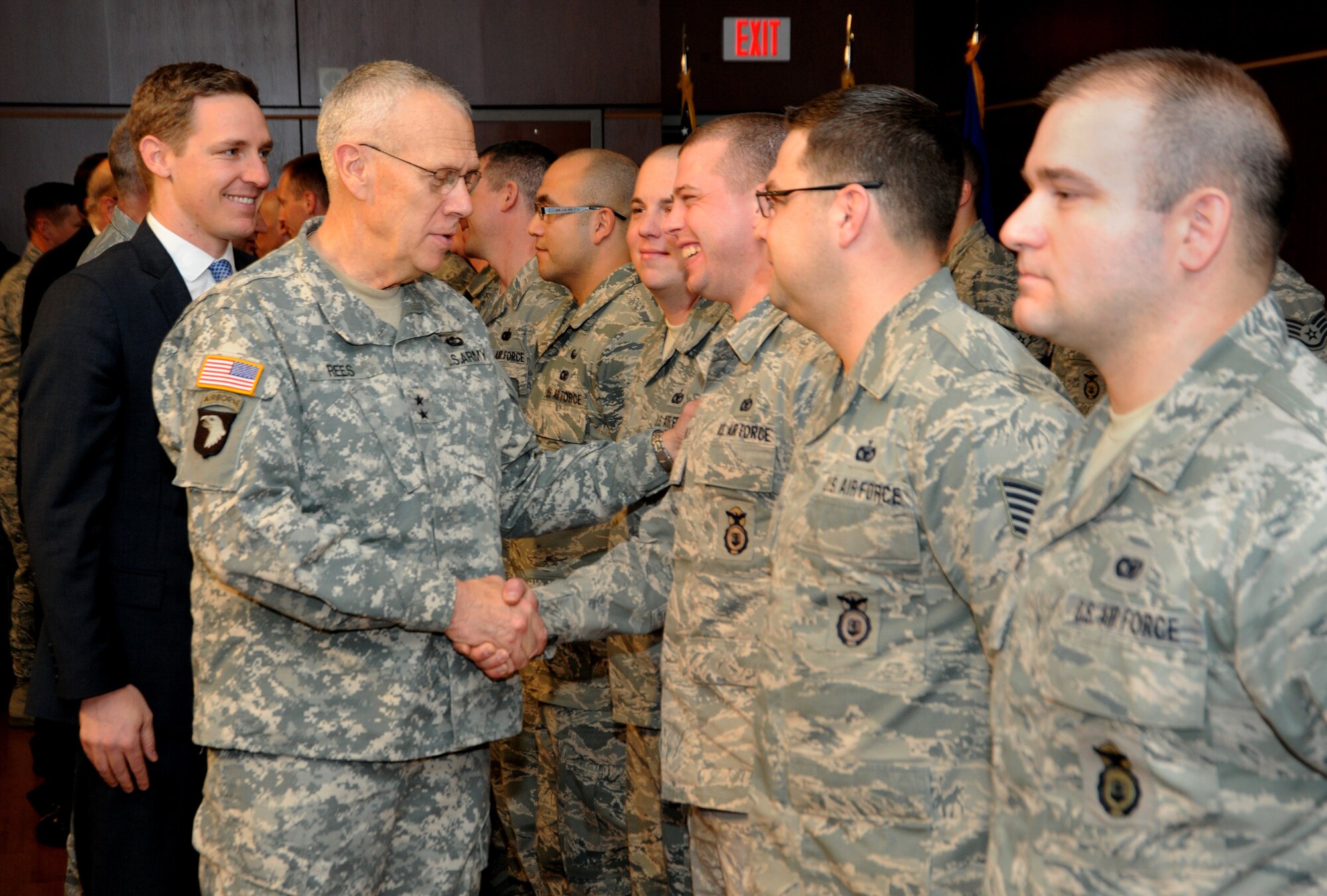 Oregon Army National Guard Maj. Gen. Raymond F. Rees, Oregon Adjutant General greets Oregon Air National Guard Staff Sgt. Jonathan S. Haapala, 142nd Fighter Wing Security Forces Squadron, during the mobilization ceremony for the 142nd Fighter Wing Security Forces Squadron at Camp Withycombe, Ore., Dec. 11, 2012. (U.S. Air Force photograph by Tech. Sgt. John Hughel, 142nd Fighter Wing Public Affairs/Released)